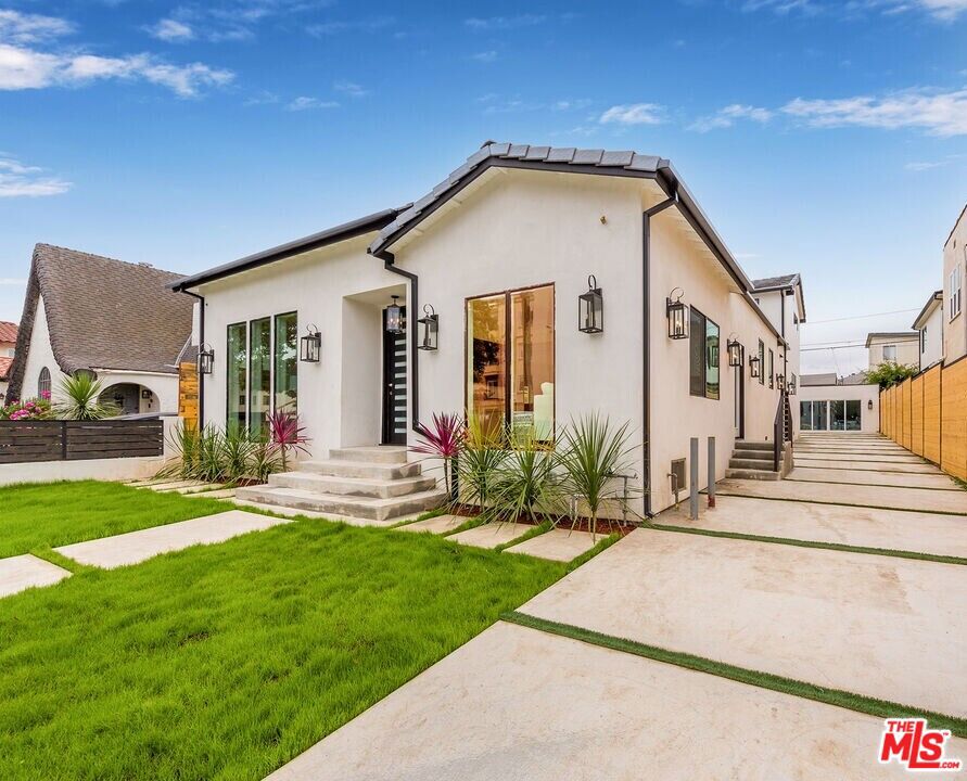 Welcome to 1441 Livonia Ave, a masterpiece of new construction that seamlessly blends timeless architecture with modern sophistication. Perfectly situated in the coveted Beverlywood/Westside area, this home places you at the center of one of Los Angeles' most desirable neighborhoods, moments from world-class dining, shopping, cultural landmarks, and easy access to Century City, Beverly Hills, and Culver City. From the moment you enter, you're greeted by soaring ceilings, abundant natural light, and a sense of refined elegance that carries throughout the home. The open and airy floor plan is designed with both entertaining and everyday living in mind, offering seamless transitions from room to room with beautifully set hardwood and tiled floors. The chef's dream kitchen is a true showstopper, boasting an ILVE dual oven and stove top complete with a water pot filler, two separate beautifully crafted copper sinks, two seperate dish-washers, a large high-end hidden refrigerator and freezer combo branded Fischer and Peykel, a generous center island, custom cabinetry, a walk-in pantry, and designer chandeliers that add the perfect touch of glamour. Whether hosting intimate dinners or large gatherings, this space elevates every culinary experience. The main level offers a spacious living room, a formal dining area, a cozy den, and a charming library nookcreating versatile spaces for both relaxation and productivity. Upstairs and downstairs, the bedrooms are thoughtfully designed to provide comfort and privacy, each featuring generous proportions, walk-in closets, and spa-like bathrooms with both bathtubs and showers. Subtle linear A/C vents keep the aesthetic clean and modern while ensuring year-round comfort. Outside, the property offers a tranquil retreat with a front yard and a large private backyard, both with lush green grass, perfect for hosting summer barbecues, playing outdoors, or simply enjoying the California sunshine. The fully gated grounds provide both security and serenity, while a detached finished garage structure in the rear, already connected to utilities, offers endless possibilities for a guest house, ADU, creative studio, or private office. Every detail of this residence has been carefully curated to create a home that is as functional as it is breathtaking. With its prime location, exquisite finishes, and rare combination of indoor and outdoor living, 1441 Livonia Ave offers a lifestyle that is truly unmatched in Los Angeles. **THE PROPERTY IS OCCUPIED - PLEASE DO NOT DISTURB THE OCCUPANTS - PLEASE REACH OUT FOR MORE PHOTOS AND INFORMATION**