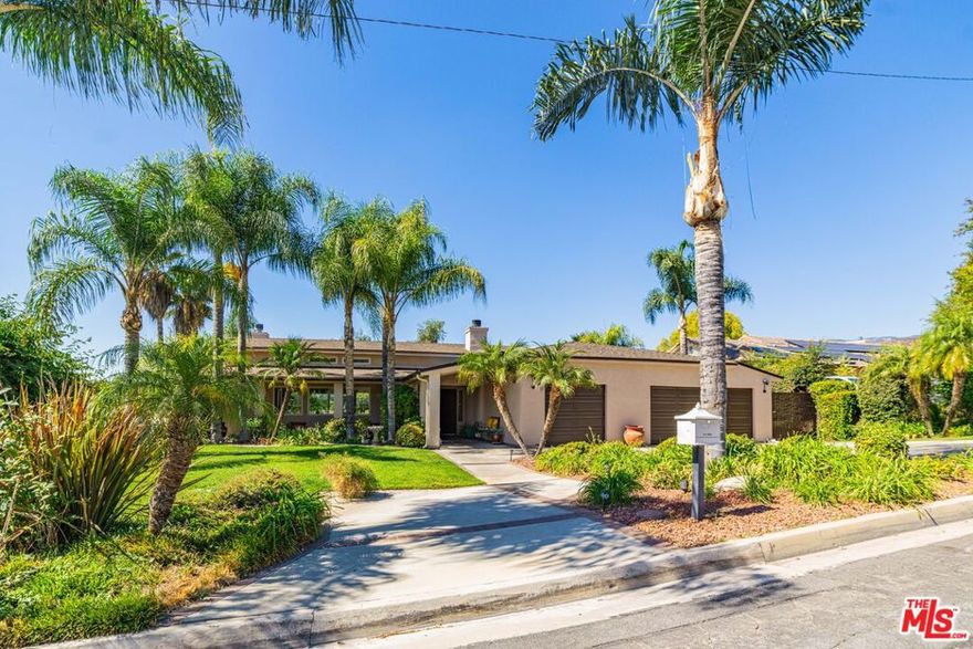 Experience the best of Southern California living in this beautifully designed 3-bedroom, 2.5-bath home that blends comfort, style, and effortless indoor-outdoor living. The formal living room welcomes you with soaring ceilings, clerestory windows that flood the space with natural light, and glass doors that open to the patio overlooking the pool. An elegant fireplace adds warmth and charm. The chef's kitchen is equipped with an oversized built-in refrigerator, a five-burner stovetop, and a built-in microwave and oven. Custom brick flooring and rich wood cabinetry create a timeless sense of warmth and sophistication. The open floor plan flows seamlessly into the family room with a fireplace and the dining area, perfect for gatherings. A conveniently located powder room serves guests with ease. The primary suite is a peaceful retreat featuring a private garden-view patio, a large dual-sink vanity, a soaking tub, and a spacious walk-in closet. Two additional bedrooms provide ample space and direct access to the garden, along with a shared guest bath. Step outside to your private backyard oasis with a sparkling pool, covered patio with ceiling fans, and breathtaking city-light view for entertaining or quiet evenings at home. The finished three-car garage with built-in cabinets offers exceptional storage and convenience. This home is the perfect blend of functionality, elegance, and California lifestyle, a true haven for everyday living and memorable gatherings.