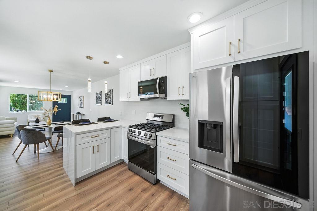***INTEREST RATE as LOW as 4.5%, that is correct, why wait for the Fed to lower rates? This Home comes with a 2-1 Rate Buydown, reducing the Buyer’s Interest Rate by 2% for the 1st year of their loan & 1% the 2nd year. All paid by the Seller & Lender.*** Located in NORTH PARK, this property has been COMPLETELY REMODELED like a BRAND-NEW HOME. This property includes a New Roof, New Stucco, New Windows, New Laminate Flooring, New Electrical, Plumbing & Sewer Systems, New Mini-Split HVAC System (AC & Heater), New Drywall, New Interior Paint, New Water Heater & SO MUCH MORE!!! The Designer Kitchen has been completely updated with all New Cabinets, including a Pantry, Quartz Countertops with a Quartz Waterfall Peninsula, Smart Energy Efficient Stainless-Steel Appliances (French Door Refrigerator, Self-Cleaning Range with a Convection Oven, Dishwasher & Microwave), Tiled Backsplash, Faucet, Deep Sink, and a Waste Disposal. The Laundry Room is inside the home with room for a stackable Washer & Dryer. ADDITIONAL UPGRADES include the following NEW items: Doors (exterior & interior), Garage Door with Opener, Insulation (exterior walls & attic), LED Lighting Fixtures (exterior & Interior), Recessed Lighting in the Kitchen, Living Room, Bathroom & Hallway, Ceiling Fans in the Bedrooms, and a Vanity with Faucet, Mirror & Toilet in the completely remodeled Bathroom, which includes a Walk-In Shower with Designer Tile. Landscaped Front Yard with drought tolerant landscaping. Fully Fenced Back Yard. Lots of Parking in the New Concrete Driveway, including a New Concrete Patio on the Back Yard. The Home is in the perfect location to walk to Restaurants, Shopping, and all that North Park has to offer! Please note that the Staging Furniture located in the kitchen, dining room, living room, bedrooms, and bath is not included in the sale of the property.