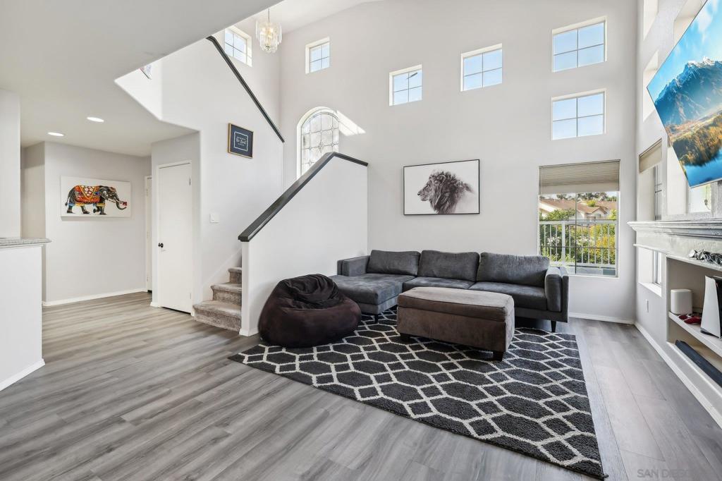 Nestled in a beautifully maintained gated community, this stylish 2-bedroom, 2.5-bathroom townhome offers the perfect blend of comfort, functionality, and charm. Spanning 1,236 square feet, the home features a light-filled open layout with tasteful updates and modern finishes throughout. Step inside to discover a spacious living area with a cozy fireplace, sleek flooring, and ample room for entertaining. The kitchen boasts stainless steel appliances, generous cabinet space, and a breakfast bar that flows seamlessly into the dining area. Upstairs, both bedrooms offer en-suite bathrooms and large closets, providing an ideal setup for privacy or guests. Enjoy the convenience of in-unit laundry, an attached garage, and your own private patio — perfect for morning coffee, outdoor dining, or a quiet escape. The community offers a resort-like atmosphere with amenities that include a pool, spa, and lush green spaces. Ideally located near shopping, dining, and a short drive to the beach, this home offers relaxed Southern California living with gated security and low-maintenance comfort.
