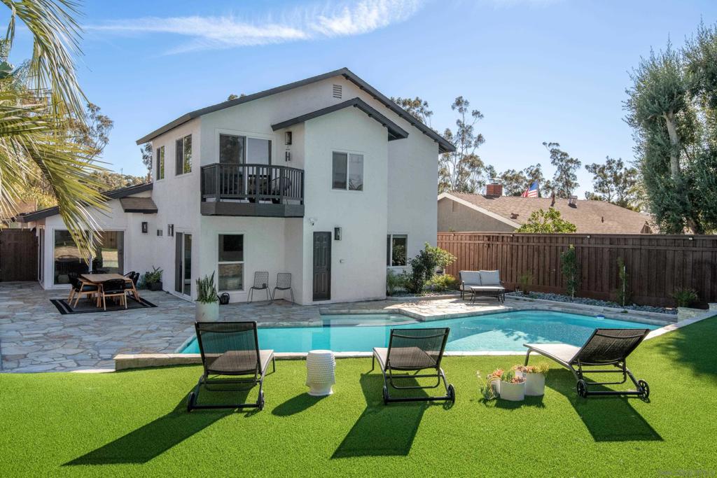 Welcome to the sought-after Scripps Ranch neighborhood! Step into the comfort of your new home through a private courtyard entry, where you'll discover a 4-bedroom, 3-bathroom residence. The airy and luminous turnkey open floor plan is highlighted by new French doors in the living room, leading to a charming front courtyard, and two sliding doors in the dining room, allowing natural light to illuminate the common areas. On the main level, find three bedrooms alongside a bonus primary room. Upstairs, a private primary room awaits, featuring a stunning spa-like en-suite and a balcony overlooking the pristine pool with Solar.