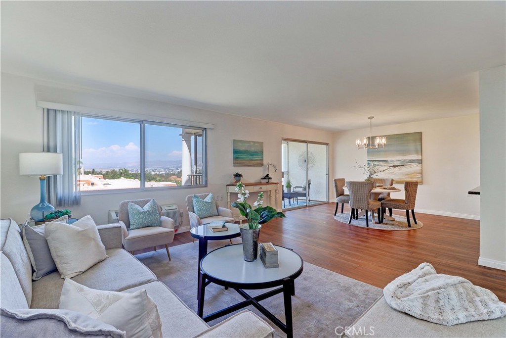 Gate 14 living!! Enjoy this coveted area with some of the best views in Laguna Woods. Remodeled 2BD/2BA "Villa Nueva" features a beautiful, open kitchen with rich wood cabinetry, granite countertops, recessed lights and upgraded appliances. Adjacent dining area has new light fixture and leads out to the glass enclosed balcony to take full advantage of this great location. The view looks towards the north to the orange balloon, city lights and to the east is Saddleback Mountain - top of the world beauty! Upgrades include vinyl plank floors, smooth ceilings, fresh paint, brand new switches and outlets. Spacious living room also enjoys the view though a large window. Both bathrooms contain upgraded granite-topped vanities, new mirrors and fixtures. Guest bathroom has tub with tile surround and glass enclosure while the primary bath has tiled walk-in shower. 2 generous sized bedrooms complete with plantation shutters. Located on a lovely cul-de-sac with just 2 buildings and eucalyptus grove. An added treat is enjoying the spectacular view driving out of your street - a daily reminder of why Gate 14 is so special! Laguna Woods Village residents enjoy a 27-hole championship golf course, a 9-hole executive par 3 course, pickleball and tennis courts, lawn bowling, gyms, clubhouses, swimming pools, horse stables, gardening centers, artist studios, computer workrooms and classes, RV parking, complimentary shuttle service around the community + over 200 clubs and organizations. CHECK OUT THE VIRTUAL WALK-THROUGH TOUR - CLICK ON ON THE WHITE CIRCLES TO WALK THROUGH, 360 ICON TO GO OUTSIDE AND SEE THE VIEW AND WALKING PERSON ICOM TO COME BACK INSIDE. ENJOY!