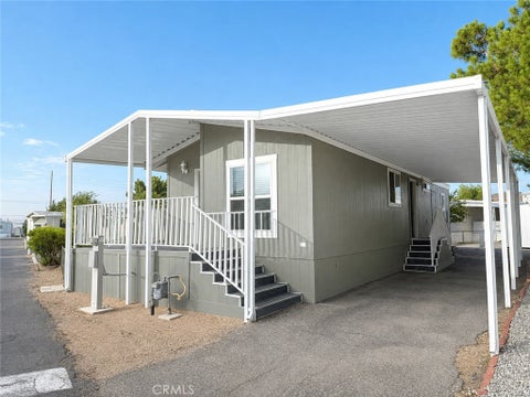 Photo of 22601 Bear Valley Road #33, Apple Valley, CA 92308 (MLS # HD26175743)