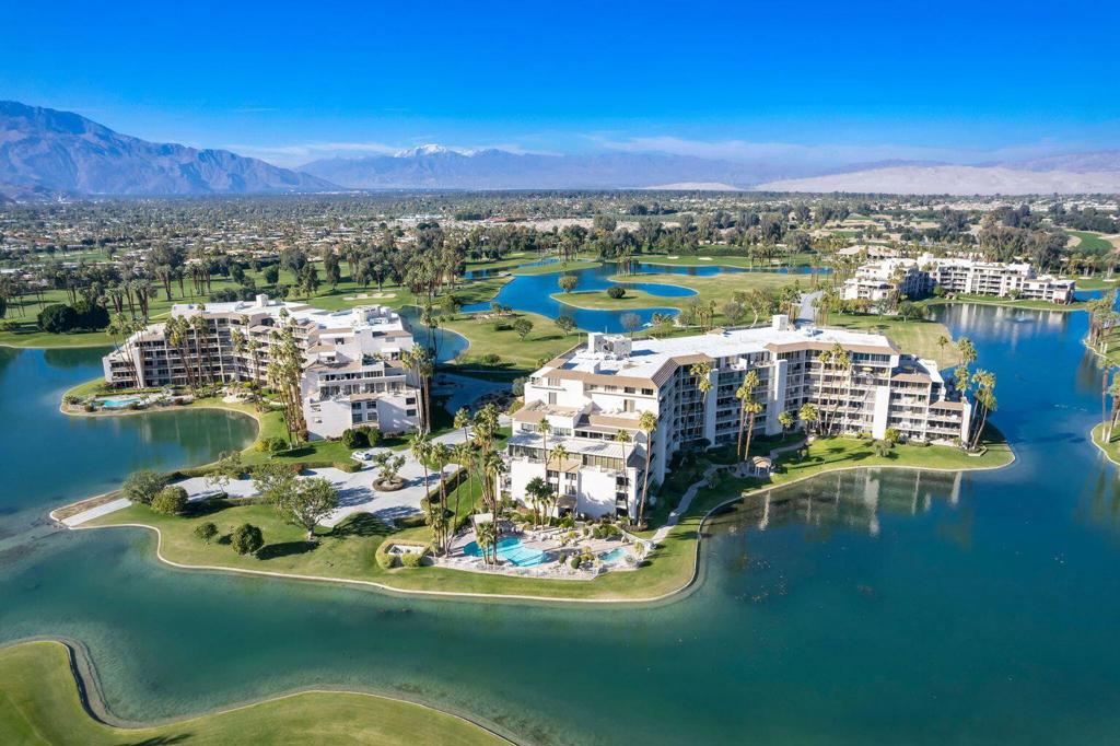 Spacious First-Floor Condo with Mountain Views in Desert IslandEnjoy resort-style living in this beautifully updated first-floor condo with sweeping views of the San Jacinto Mountains. Featuring an open-concept layout, the kitchen flows effortlessly into the living and dining areas--ideal for entertaining or relaxing.A large slate-tiled terrace extends your living space outdoors, perfect for morning coffee or evening sunsets. The primary suite includes a walk-in closet with custom built-ins for optimal storage and organization.Located in the exclusive Desert Island community--a 25-acre gated oasis in Rancho Mirage--this home is surrounded by a sparkling lake and an 18-hole championship golf course. Residents enjoy an unmatched lifestyle with access to:Heated swimming pools and spasTennis and pickleball courtsScenic walking paths and fruit treesPedal boats and catch-and-release fishing24-hour guard-gated securityHOA dues include most utilities, cable TV, and internet, offering added value and convenience.Don't miss this rare opportunity for luxury, location, and lifestyle--all in one!Buyer to verify square footage.