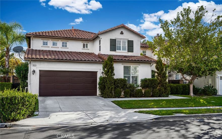Step inside this beautifully upgraded 5-bedroom, 3-bath home located in the highly sought-after gated community of Citrus Heights in North Fontana. With generous living spaces and thoughtful design throughout, this home perfectly balances everyday comfort with impressive style. The open-concept floor plan creates a seamless flow from the living and dining areas to the spacious kitchen, which is a true chef’s delight featuring rich wood cabinetry, granite countertops, a custom backsplash, and plenty of room to gather and entertain. Downstairs, you’ll find a bedroom and full bath, ideal for guests or multi-generational living. Upstairs, the remaining bedrooms offer space and privacy, along with a huge loft that is perfect for a home office, game room, or cozy second family space. Every detail has been elevated, from travertine tile floors on the main level and elegant wood flooring upstairs to fresh paint, upgraded baseboards, and custom chair rails throughout. The wrought iron front door and decorative entry medallion make an unforgettable first impression. Step outside to your private backyard retreat, complete with a large, covered patio framed by mature trees, ideal for hosting friends or simply unwinding in the shade. Even the washroom features travertine floors, adding a touch of luxury in every corner. The 3-car tandem garage offers plenty of space for vehicles, storage, or a workshop setup. With its prime location, stylish upgrades, and tranquil outdoor living, this North Fontana gem is move-in ready and waiting for its next chapter. Come experience the best of Citrus Heights living!