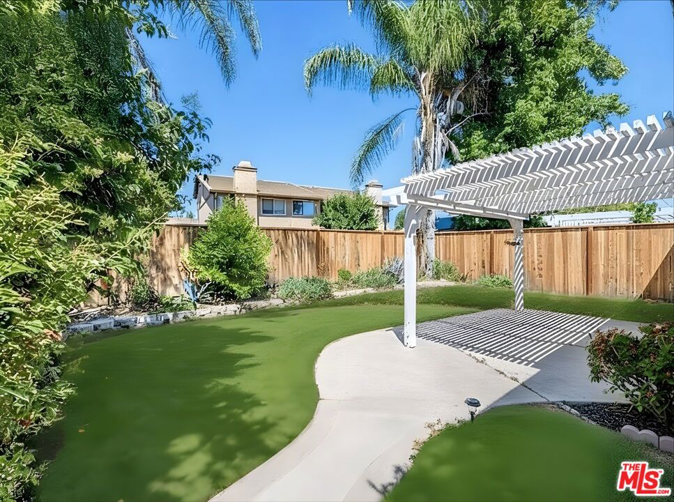 Heart of Valencia Single Story 3 Bed / 2 Bath. Immediate Move In! Beautifully remodeled single-story home on a quiet cul-de-sac in the heart of Valencia. This light and bright residence offers 3 bedrooms, 2 bathrooms, and an open floor plan with recessed lighting throughout. The modern kitchen features updated appliances, white countertops, a large island with pendant lighting, and sleek soft-close cabinetry. Enjoy a private backyard with covered patio, landscaped front yard, and an attached 2-car garage with storage, washer/dryer, and EV charging capability. Conveniently located near community pools, playgrounds, paseo trails, award-winning schools, shopping, and dining. Available for immediate occupancy. Easy to show!