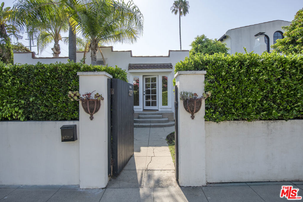 Located on a spacious gated lot in the heart of Melrose District, this charming side-by-side duplex includes a 2-bedroom, 1-bath residence with approximately 1,150 sq. ft. of living space and a separate ADU guest house at the rear of the property. The apartment features a semi-private front yard, central heat and air conditioning, all appliances including in-unit washer and dryer, and access to a shared rear deck and yard. Offered unfurnished with a minimum one-year lease. Owner covers water, sewer, and gardener; tenant responsible for remaining utilities. Small dogs under 20 lbs may be considered with additional deposit. Street parking only.