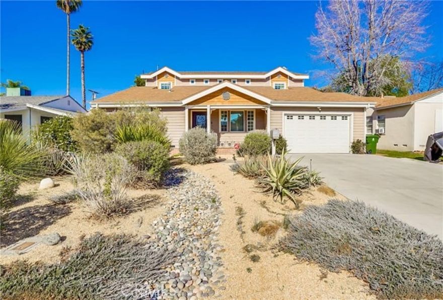 Welcome to this stunning home in the highly sought after Valley Village neighborhood. Located on a quiet, tree-lined street, this home has it all. With over 3,000 sf. of living space situated on a large, 8,100 sf. lot, this exquisite home is perfect for entertaining and everyday living. Lovingly constructed and meticulously maintained, this amazing home boasts 5 bedrooms and 5 baths with a one-of-a-kind design you do not want to miss! Downstairs features a sun-drenched open floor plan with a two-story grand entry, formal dining room and large family room opening to a spacious kitchen with a large center island and breakfast bar. The huge master suite features large walk-in closets and a master bath including his and her vanities, over-size tub and dual showers. Amazing entertainer's yard features a sparkling pool and spa, large grassy area and a bath-cabana, great for family get togethers. Walking distance to places of worship, minutes to Studio City, and main highways. This one is a must see and will not last long!!