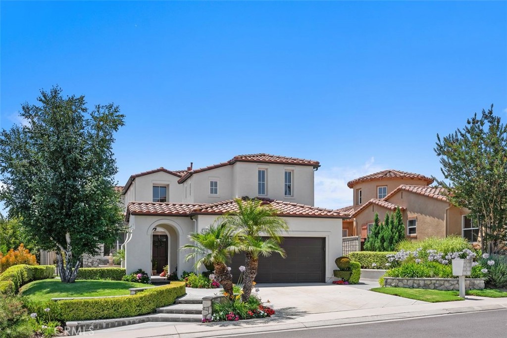 This stunning 4-bedroom, 3-bathroom home offers 2,703 square feet of thoughtfully updated living space on a cul-de-sac in one of Coto de Caza’s most desirable neighborhoods. Step through the large, elegant front entry—highlighted by a tranquil fountain—and into a home that blends modern comfort with timeless charm. The lower level features a private office and bonus room with an adjacent bathroom, ideal for guests or remote work. The formal living and dining rooms boast French doors opening to the backyard, perfect for indoor-outdoor entertaining. The open-concept family room and kitchen area invite gatherings and everyday enjoyment. Enjoy peace of mind with recent upgrades including full repiping, a newer HVAC system, updated stair railings, and refreshed lighting. Freshly installed luxury vinyl plank flooring and carpet add a modern touch throughout. Upstairs, the spacious master suite is a true retreat, featuring a cozy fireplace and expansive views of the hills. The fully remodeled master bathroom showcases sleek, modern vanities, a re-done walk-in shower, freestanding tub, and dual built-in closets. All bathrooms and the laundry room upstairs have also been tastefully remodeled with contemporary finishes. Additional highlights include a generously sized secondary bedroom with a charming nook, plantation shutters throughout, and a garage outfitted with custom built-in cabinetry and overhead storage. Step outside to a covered patio and soak in the peaceful hilltop views. Coto de Caza offers a prime location near the 241 toll road, combining luxury living with convenient access. The community has two 18-hole golf courses, sports courts, parks, scenic hiking and walking paths, equestrian trails, and the option for country club membership. This is a home where quality, function, and style meet. Come experience all that this exceptional property in Coto de Caza has to offer.