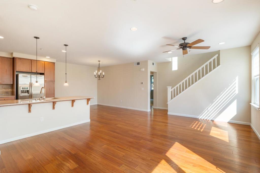 Ideally situation between downtown San Jose and Willow Glen, this Tri-level townhouse has 3 bedrooms and 3 full baths in over 1600 square feet. Main floor offers an open floorplan with high ceilings and hardwood floors, a well appointed kitchen, dining area and balcony. Kitchen has stainless appliances, granite counters and ample storage plus a breakfast bar. The main living area comes together for a bright and inviting atmosphere. Main level is completed with a full bath and bedroom. Upstairs you will find two more bedrooms, both with private full baths. The primary bedroom also includes a spacious walk in closet. Full size washer/dryer are located on the top floor. Ground floor entry with attached two car garage with work bench. Unit has dual paned windows and water softener. Complex has open space near the unit plus Del Monte Park and Los Gatos Creek Trail are close by. There is abundant guest parking as an added bonus. One year lease minimum. Close to Light Rail, Caltrain, 280,101. No pets. Available immediately.