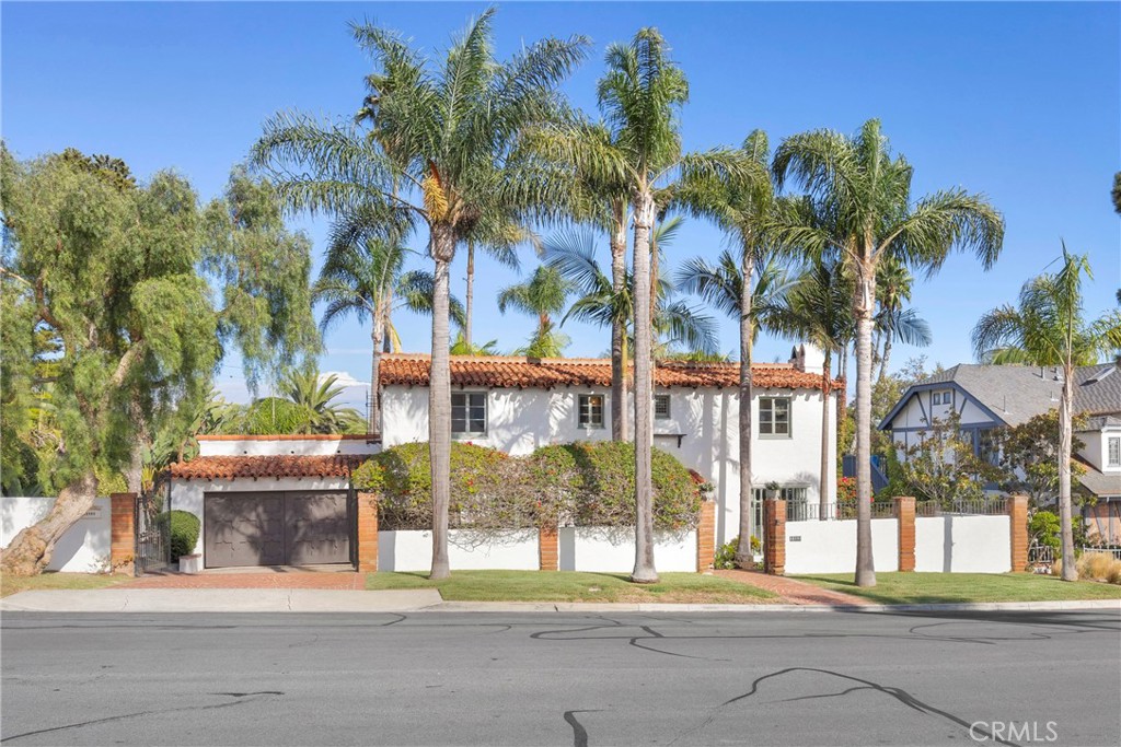 Step into Dana Point’s history with this rare 1928 Woodruff home located on one of the most desirable streets in the city. Rich in character and charm, this Spanish-style gem is preserved under the Mills Act Historic Property Preservation Agreement, providing substantial property tax savings. Inside, you’ll find 2 bedrooms and 2 newly remodeled bathrooms, with tasteful updates that blend seamlessly with the home’s preserved details. Original wood floors on the staircase and second level, stained glass windows, and the home’s original garage doors showcase its timeless craftsmanship. The primary suite offers a newly remodeled en suite bath along with a spacious deck—perfect for morning coffee or evening relaxation. Just off the garage, a bonus room with a half bath creates the ideal space for a home office, art studio, or guest quarters. The backyard welcomes you with a large covered patio and a generous lot that extends through to Valencia Place—well-suited for a future ADU or pool. This historic home combines preserved character with modern comforts, all just moments from downtown Dana Point, The Strand and Salt Creek beaches, and the soon-to-be revitalized Dana Point Harbor.