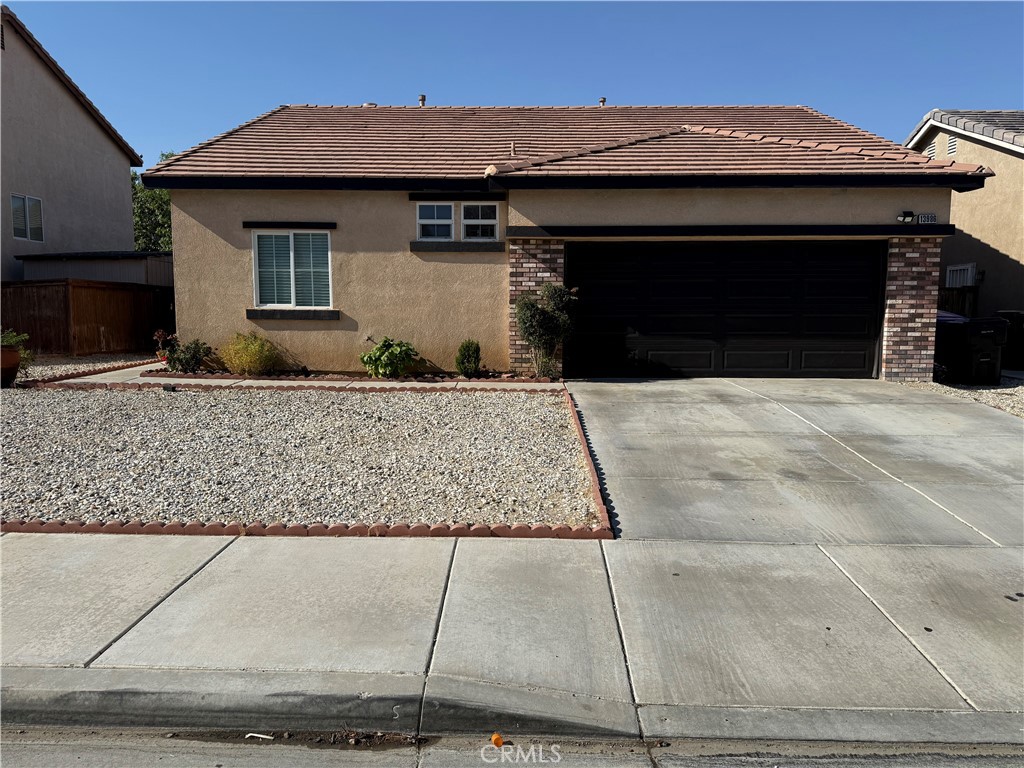 This is a beautiful 3-bedroom 2 bath home with a 2-car garage, No Hoa, and a good size front and backyard. The home is well kept up and maintained. Landscape is Desert Rock in the front yard/ and dirt yard in the back, living room has a Gas Fireplace, and features laminate flooring throughout and is beautiful complimented with 4.5-inch baseboards, Kitchen has Granite counter tops and backyard door access and custom painted cabinets. Home has Upgraded Lights and ceiling fans in every room, and a huge Island That has room for 6 Seats, Above is a glass rack and a Beautiful Tuscan Iron Pot Rack.
Master Bedroom is good size with Direct access to Bathroom, there are smoke detectors throughout, and a washer and Dryer room inside the house. Garage is big with a Hot water Heater (Strapped). Back yard is fully Fenced and has room for Barbecue and Entertainment.