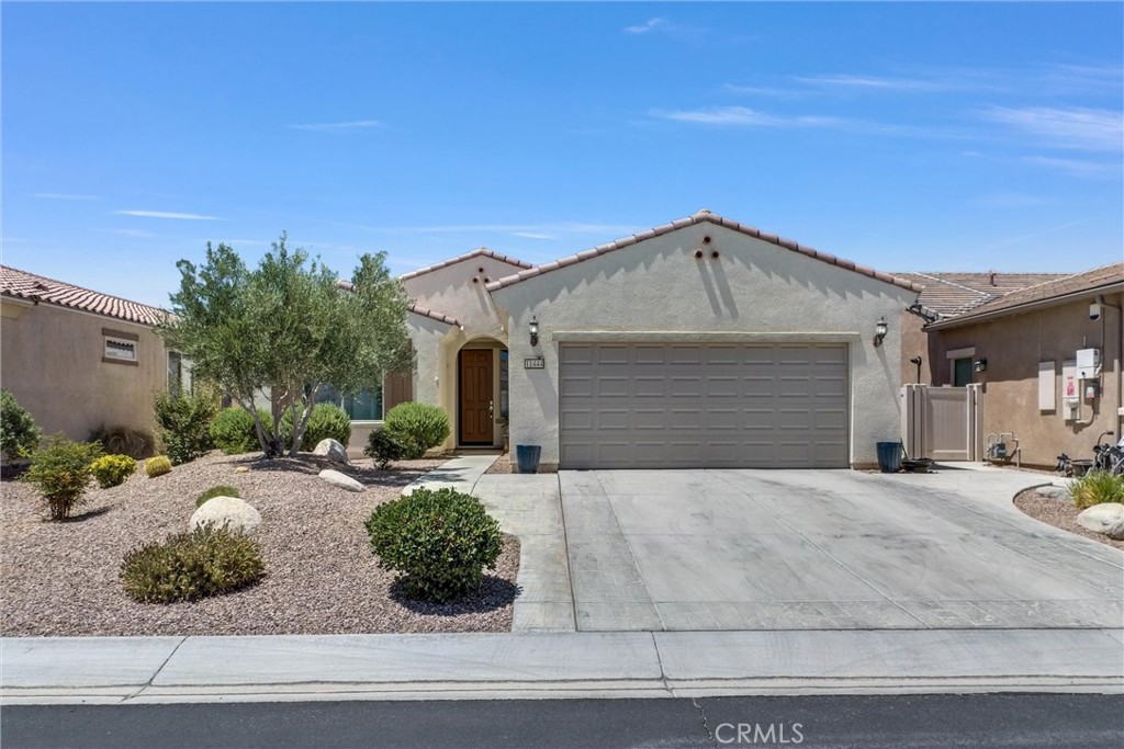 This gorgeous 2 bed 2 bath with bonus room is located in one of the vibrant 55+ Del Webb communities where it will exceed all your needs with all the abundance of amenities! There are pools, pickleball courts, tennis courts, daily events for residents, and fitness center. Coming into the foyer you will enter the expansive open concept kitchen/living room area where vinyl plank flooring flows through almost the entire home. The primary bedroom has an ensuite bath with double sink wrap around vanity and a side by side tub/shower combo and walk in closet. Each of the addition two rooms are located closer the the front of the home on opposite sides of the hallway from the foyer. The beautifully landscaped backyard has a oversized concrete patio with built in patio cover along with upgraded turf across the yard for easy maintenance and perfect for relaxing or entertaining. Look no further, this is the one!