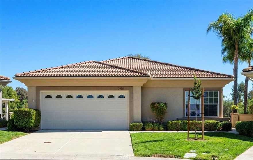Welcome to the best location on the golf course at The Colony – Murrieta’s premier 55+ gated community!

Enter through your private gate into a charming yard—unique to this home’s location—before stepping inside this beautifully maintained single-story residence. Offering the perfect blend active adult living, this home sits on a quiet cul-de-sac overlooking the 1st fairway. The spacious, light-filled floor plan features vaulted ceilings, custom tile flooring, plantation shutters, and a cozy fireplace.



The well-appointed kitchen and dining area include rich wood cabinetry, Corian countertops, Bosch dishwasher, stainless steel LG oven and built-in microwave, a six-burner gas cooktop, large pantry, and the stainless steel refrigerator is included.



The primary suite features vaulted ceilings and opens directly to the covered wrap-around patio with golf course views. The en-suite bathroom offers dual sinks, a soaking tub, walk-in shower, separate vanity, and a large walk-in closet. Two additional bedrooms are generously sized with wood floors, and the second bathroom also includes a walk-in shower. The large laundry room provides abundant cabinetry, a deep sink, and comes complete with washer and dryer. You'll also enjoy direct access to the two-car garage with built-in cabinets.

Residents of The Colony enjoy resort-style amenities including an 18-hole public golf course (fee), clubhouse, pool and spa, fitness center, tennis and pickleball courts, plus a vibrant calendar of social clubs and community events. The 24/7 guard-gated entry ensures peace of mind in a beautifully maintained setting. Ideally located near Temecula Valley’s renowned wineries, Old Town Temecula, shopping, dining, and top-rated medical facilities. Nearby hiking trails, scenic drives, and outdoor recreation make this the perfect place to enjoy the best of the active Southern California lifestyle.
