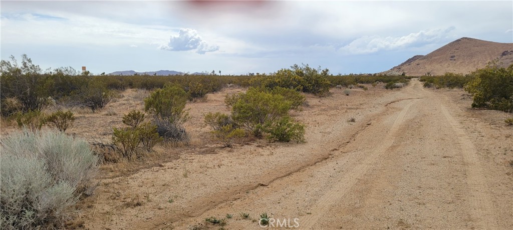 Flat 2.10 Acres for sale; Nice Mountain views, rural area, close to HWY 14 for easy access; Not far off Backus Rd.