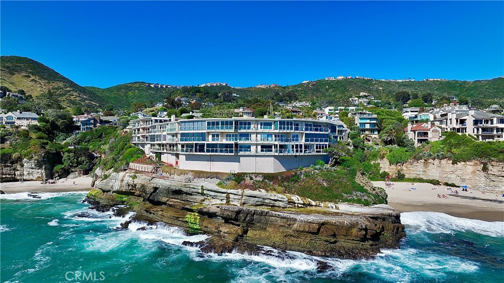 Escape to an exquisite, fully furnished oceanfront retreat that epitomizes the essence of beach paradise. Nestled within the coveted Table Rock community of Laguna Beach, this extraordinary residence offers an unparalleled experience. Immerse yourself in the majestic waves below, while reveling in sweeping views of Catalina, captivating sunsets, abundant marine life, and picturesque coastline extending from the North to South.
Positioned within one of the most sought-after locations in Table Rock, this residence exudes serenity and exclusivity with impeccable ocean views, allowing you to bask in the beauty of the sea from the comfort of your beach retreat. The open floor plan boasts luxurious finishes and a contemporary style, seamlessly connecting the living room and seating area to the ocean through glass sliding doors.
Awaken each morning in the main bedroom to a ocean paradise. The secondary en-suite, currently utilized as an office, offers versatility with a Murphy bed, comfortable seating, TV, and a dedicated workspace. Additional features include indoor laundry with washer & dryer, four mini splits with heat & AC, 1 car space in a shared two-car garage, and one permitted guest parking spot, subject to availability. Conveniently bypass any stairs with the use of the elevator, ensuring easy access to the residence.
The Table Rock Community boasts a serene atmosphere, with a lush grassy courtyard and inviting pool area. Indulge in an array of amenities, including direct beach access to West Beach and mere steps to Table Rock Beach. Unwind by the pool or in the jacuzzi, savor the BBQ area over looking the beach, or engage in a game of shuffleboard or ping pong. Clubhouse has a pool/billiards room and gym, offering additional leisure and recreation.
You’ll find yourself just steps away from restaurants, hiking trails and the Trolley that will transports you along the breathtaking coastline to a wealth of attractions as you venture out into Laguna Beach where you'll discover a plethora of other beaches, shopping, nightlife, The Montage Resort, The Ranch golf course, and Art district.
Embrace oceanfront living year round at this Table Rock residence.