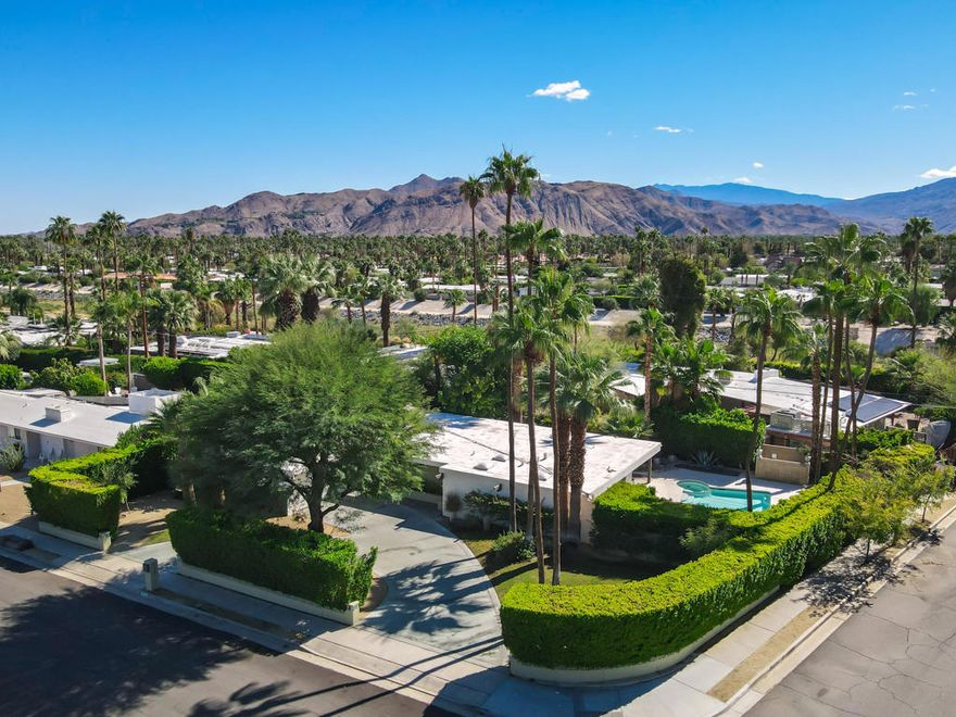 Experience the allure of iconic mid-century modern design with this masterfully crafted home by renowned architect Hugh M. Kaptur, located at 823 E. San Lucas Road, Palm Springs. This architectural gem offers a harmonious blend of historical authenticity and modern convenience. Mr. Kaptur's distinctive style of Organic Desert Modernism is beautifully encapsulated in this residence, designed to complement the natural desert landscape seamlessly. Known for his ability to harmonize structures with their surroundings, Kaptur's work on this property is characterized by thoughtful integration and respect for the natural environment. Step inside to discover two of the three bathrooms retain exquisite mid-century tile, preserving the authentic charm of the era. The home's signature board and batten detailing, along with distinctive beam ends, are a testament to Kaptur's innovative design vision. The elegant slate flooring seamlessly merges indoor and outdoor spaces, enhancing the home's natural flow. The property is a haven for those who love to entertain, featuring multiple outdoor areas perfect for gatherings, alongside a tranquil koi pond that adds a touch of serenity to the landscape. The kitchen has been thoughtfully upgraded by Kaptur in 2011 to cater to contemporary living while retaining the home's original character. Hugh M, Kaptur, celebrated for his contributions to the Palm Springs architectural landscape, is known for creating spaces that are both functional and artistically significant while creating his objective of ''quiet elegance.'' This home is not just a residence; it's a piece of architectural history waiting to be cherished by its next owner.