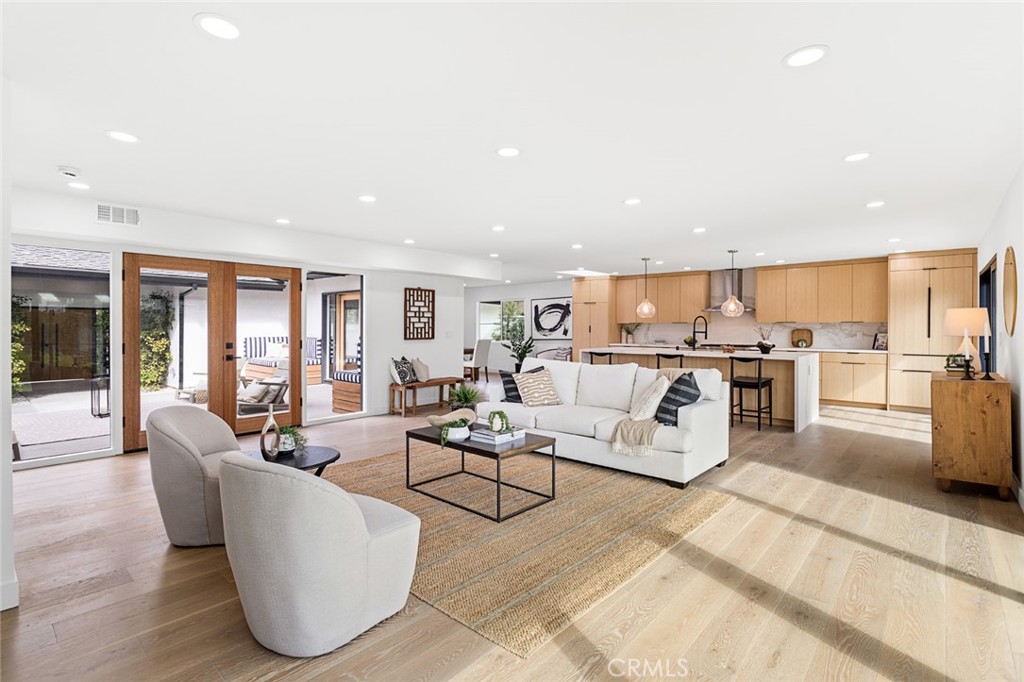 Nestled in the prestigious Salt Creek neighborhood of Laguna Niguel, this stunning remodeled home offers a perfect blend of luxury and comfort. With 4 bedrooms, 3 bathrooms, and 2,338 square feet of meticulously designed living space, this property is ideal for those seeking a serene and upscale lifestyle.
Situated on a generous 12,632 square foot lot, the home provides ample outdoor space, featuring a beautifully landscaped yard with custom Mangaris wood decks in both the front and backyard, artificial turf, and a custom cable railing. The spacious 3-car garage and single loaded street enhance privacy and convenience.
This home is situated in the sought-after Vista Del Niguel subdivision, offering a peaceful and serene atmosphere with breathtaking golf course views.
Step inside to discover a modern oasis. The new panel-ready kitchen appliances from Signature Kitchen, complemented by Bedrosians Porcelain Slab in Calacatta Super White, set the tone for culinary excellence. The kitchen also boasts a sleek black granite sink, mouth-blown glass pendants from Arhaus, and a geometric dining pendant from CB2, creating an inviting space for entertaining and daily living.
The home is adorned with new interior glass panel shaker doors, black panel mirrored closet doors in all bedrooms, and stylish Top Knob matte black cabinet pull handles. The fully remodeled primary bath features a custom rift white oak vanity, a fluted standalone tub, and Delta champagne bronze finishes. Each bathroom is equipped with new Toto toilets, ensuring a luxurious and comfortable experience.
Additional highlights include brand new courtyard French doors with SmartKey locks from Urban Doors, modern front entry doors in white oak with commercial-grade stainless steel pull handles, and new exterior light fixtures. The aluminum frame garage door, new smooth stucco, recessed lighting throughout, and paid solar panels enhance the home’s modern aesthetic and energy efficiency.
For outdoor enthusiasts, the property features a custom outdoor kitchen and BBQ area, a Spa Hot Tub by Aqua Rest with 30 jets, a custom pergola with string lights, and meticulously designed landscaping with concrete pavers, gravel, mulch, and 15-gallon ficus and Podocarpus plants. The new TPO roof and rain gutters ensure durability and low maintenance.
Experience the epitome of luxury living in Laguna Niguel with this remarkable property.