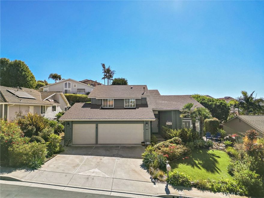 A beautifully maintained home in the highly desirable Coast Development! Less than a mile from San Clemente’s best beaches and surrounded by scenic ocean-view walking trails. This ideal floor plan includes a remodeled kitchen, three updated bathrooms, and a private downstairs bedroom suite. The main level showcases tasteful neutral tile flooring, while the upstairs features distinctive non-slip barn-style wood floors. Light and bright throughout, with soaring ceilings and numerous upgraded windows with plantation shutters. The stylish kitchen overlooks a lush, private backyard with lemon/orange tree—perfect for entertaining. Highlights include a large farmhouse sink, Quartz countertops, premium appliances, abundant cabinetry, and a convenient breakfast bar. The adjoining family room offers a grand brick fireplace and garden views through expansive windows. Upstairs, the spacious primary suite enjoys peaceful greenbelt views—a haven for hummingbirds and butterflies. It features two closets (including a walk-in) and a luxurious bathroom with a spa soaking tub, oversized walk-in shower, high-end cabinetry, glass vessel sinks, skylights, and a peek-a-boo ocean view. Enjoy easy access to The Coast from every direction—north, south, east, and west. One of North San Clemente’s most coveted neighborhoods, close to beaches, shopping, restaurants, golf courses, and the Dana Point Marina.  Low Association fee's and No Mello Roos.