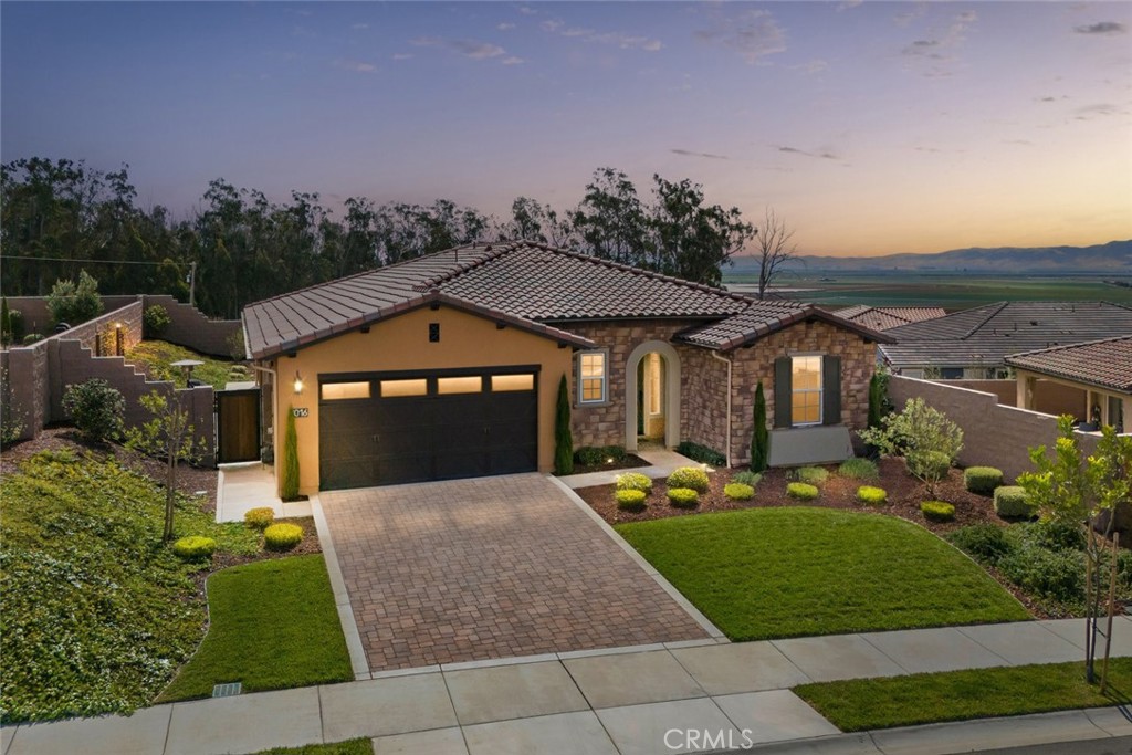 Located in the prestigious Trilogy at Monarch Dunes resort community, this thoughtfully designed newest Monterey III model offers refined coastal living with exceptional privacy and timeless style. Featuring engineered hardwood and tile flooring throughout, this single-level home blends sophistication with everyday comfort.
The open-concept layout includes a designer kitchen with quartz countertops, premium appliances, walk-in pantry and a spacious island that flows into the great room and dining area—ideal for entertaining. The primary suite features a spa-inspired bath and walk-in closet, while a versatile flex room and a custom laundry-office combo add practical functionality.
Step outside to a private backyard oasis with no rear neighbors, professionally landscaped for serene outdoor enjoyment. Additional highlights include a solar system, covered patio, 2-car garage with dedicated workshop space, and smart, energy efficient, modern conveniences designed for effortless living.
Residents of Trilogy enjoy access to championship golf, tennis, pickleball, fitness centers, indoor/outdoor pools, fine dining, and a calendar of curated social events. Whether you're seeking a full-time residence or a weekend retreat, this home offers tranquility, elegance, and an elevated lifestyle.