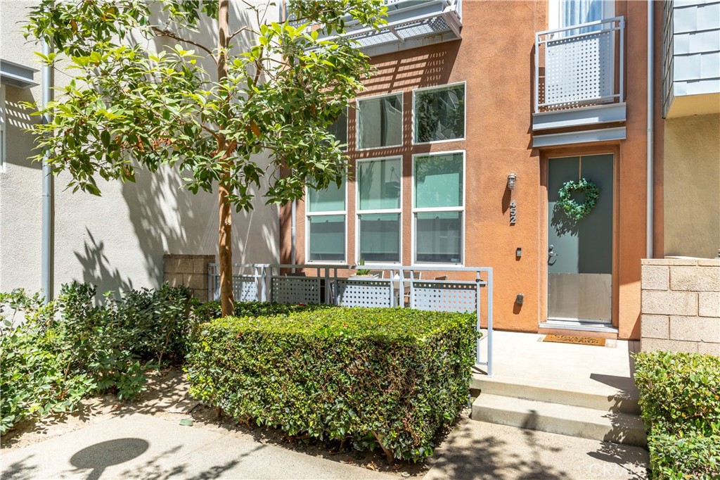 Discover the perfect blend of comfort, style, and convenience in this stunning multilevel townhouse located in the heart of one of Orange County's most vibrant communities. This expansive 3-bedroom, 2.5-bathroom residence features a versatile bonus 4th room with a closet—ideal as a bedroom, home office, guest space, or playroom—and boasts a generous 2,185 sq ft floor plan, making it one of the largest in the area. Newly upgraded with beautiful LVP flooring and fresh paint, this home is ready for you to move in and make it your own! As you step inside, you’re greeted by an inviting formal living space adorned with a cozy gas fireplace, seamlessly flowing into the open living and dining areas—a perfect setting for entertaining family and friends. The modern kitchen is a chef's dream, showcasing granite countertops, stainless steel appliances, and ample storage, all while being perfectly situated to allow for easy conversations with guests in the dining room. A conveniently located half bath rounds out this level, making gatherings a breeze. Venture to the third floor where you’ll find two generously sized bedrooms and Bonus Room. A spacious laundry room and a stylish bathroom complete this level, featuring dual sinks for added convenience. Retreat to the fourth floor where the luxurious master suite awaits, featuring a large walk-in closet and a bright, airy bedroom. The en-suite bathroom is a true sanctuary, complete with a soothing soaker tub and a separate shower—perfect for unwinding after a long day. City Place is not just a home; it’s a lifestyle. Enjoy beautifully landscaped areas, and take advantage of the proximity to Santiago Park, popular dining spots like Mother's Market, Habit Burger Grill, and The Olive Garden, as well as your favorite coffee shop, Coffee Bean. With easy access to major highways (I-5, 57, and 22) and just a short drive from the revitalized Downtown Santa Ana, this location offers the perfect balance of tranquility and urban excitement.