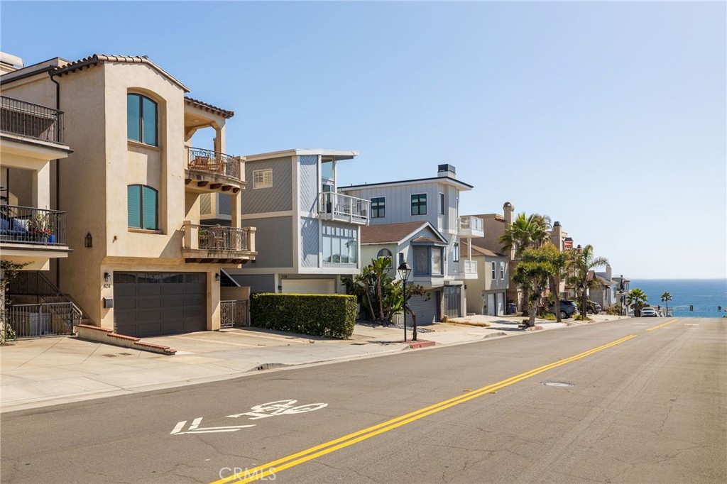 Spectacular Townhome Located in A+ Manhattan Beach Sand Section! This Ocean View Property is in Pristine Condition; with an Ideal Floor Plan that Maximizes the Views from the Main Living Area, Dining Area and Primary Suite, Each with a Spacious Balcony where you can also Enjoy the Sparkling Ocean View. High End Finishes Throughout Including Walnut Hardwood Floors, Viking Appliances, Built in Sonos Speaker System, and Many More! Functional Floor Plan where Each of the Three Bedrooms have a Dedicated Bathroom, Allowing for a Flexible Style of Living. Additional Highlights Include an Outdoor Shower; Perfect After Beach Days! As well as FIVE off-street Parking Spaces, Provided by an Extended Driveway and Carport. This Sought After Location Offers Great Walkability to Downtown Manhattan Beach as well as El Porto. Fabulously Located just a Couple Short Blocks from the Strand, the Convenience Options are Endless!