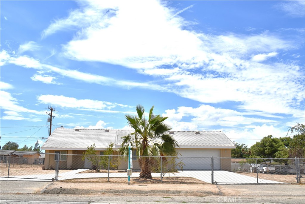 ***BONUS*** GREAT LOCATION IN HESPERIA ON A LARGE LOT WITH RV ACCESS AND A BONUS ROOM!! THIS HOME FEATURES AN ADDITIONAL (AND PRIVATE) ROOM THAT HAS BEEN USED AS A 5TH BEDROOM OR USE AS A HOME OFFICE OR GYM! Tons of features including but not limited to: is fully fenced with dual entry and exit sliding gates, circular driveway, tile roof, cathedral ceilings, fireplace, open floorplan with kitchen that opens up to family room, (has both a front room and a family room), large kitchen island, a new stove and dishwasher will be in place by the close of escrow for the buyers as well. More features include brand new carpeting, new paint, huge bedrooms, dual sinks in both bathrooms, large walk-in closet in primary bath, large soaking tub in primary bath and so much more. Finished oversized garage. The large, covered patio in rear is perfect for backyard BBQ! Centrally located, commuter friendly and close to all amenities such as shopping, hospitals, medical offices and more. Check out the NEW businesses in the works and coming to Hesperia! We are getting a Sam's club and a Dutch Brother's those are just a few on the list of exciting new developments up here. Seller will look at all offers.