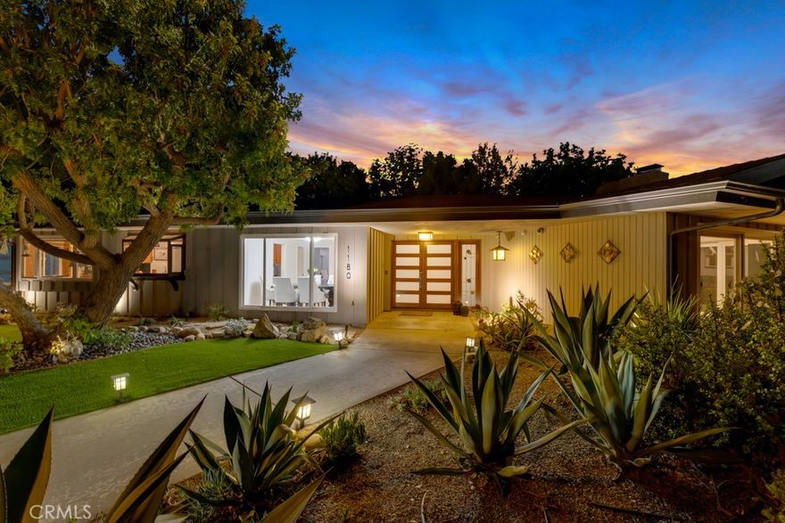 Check the comps! This is a steal. Discover this stunning single-story home in Lynn Ranch, featuring 4 bedrooms, 3.5 baths, and 3,023 square feet, all set on a private lot of over half an acre with breathtaking sunset views. **OWNED SOLAR and TESLA POWERWALLS** ensure low electric bills and peace of mind against blackouts. Prepare to fall in love with this incredible home! The large concrete driveway accommodates 6+ cars, providing ample parking. Upon entering through the modern double doors, you'll be greeted by gorgeous hardwood floors, recessed lighting, and designer touches throughout. The spacious living room boasts a beautiful fireplace adorned with a striking ebony Roman clay finish. This home is designed for seamless indoor/outdoor living, with all bedrooms, the living room, and the family room offering direct access to the backyard. The kitchen features slate tile floors, cherry cabinets, quartz countertops, and high-end stainless steel appliances, including Thermador and Bosch, as well as a wine fridge. Adjacent to the kitchen is the family room, which showcases vaulted ceilings, a skylight, and French doors leading to a tropical paradise in the backyard. The expansive master suite includes a large bathroom with a dual-sink custom vanity, slate tile, a massive spa tub, and direct access to the pool area. The master bedroom features an impressive 8'x28' closet, ensuring ample space for even the largest shoe collection, along with crown moldings and a stylish accent wall. One of the bedrooms has been converted into a home office equipped with built-in desks and bookshelves, while the other two bedrooms are spacious and share a newly remodeled Jack and Jill bathroom. All bedrooms come with ceiling fans for added comfort. The backyard is an entertainer's paradise, boasting a tiki theme that will make every day feel like a vacation. Enjoy the sparkling pool and spa, a built-in Viking BBQ, a generous patio area, lush vegetation, and a tiki bar overlooking the pool. Take in the stunning sunsets from the larger of two maintenance-free synthetic wood decks, or escape to the smaller deck hidden among the trees. Additional highlights include a convenient 3/4 bath off the pool, a large laundry room (with newer washer and dryer included), landscape lighting in both the front and back, a 2-car attached garage with a frosted glass door, and an EV charger. All of this in the incredibly desirable neighborhood of Lynn Ranch with only a $200/year VOLUNTARY HOA.