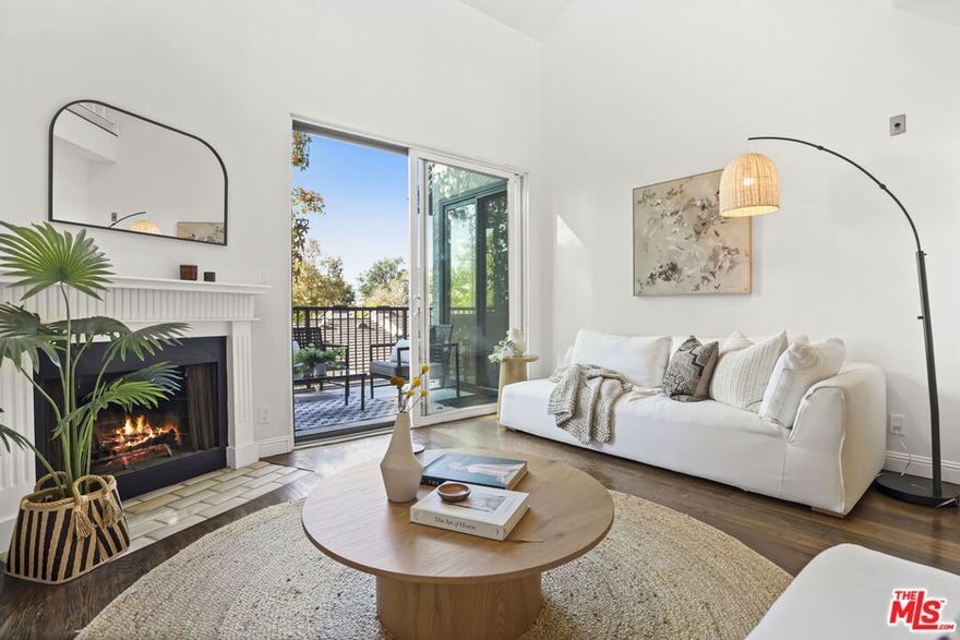 Set in a desirable area of Pasadena, this updated top floor,  two-level condo blends modern functionality with a warm sense of home. Situated in a well-maintained community of long-term residents, the outdoor areas provide a resort-like setting surrounded by lush greenery and various fruit trees such as apple, tangerine, kumquat, and lemon. Inside, you will be pleasantly surprised with the tasteful upgrades and attention to detail. The soaring double-height ceiling in the living room adds a sense of excitement to the space. Accessible from both the living room and the primary suite, the large balcony is perfect for relaxing mornings with your cup of coffee, or an enjoyable and fun evening with friends and family. The galley kitchen boasts beautiful new quartz countertops and herringbone backsplash, new tile flooring, new stainless steel appliances, a wine cooler and an eat-in area. The split floor plan provides for optimum privacy. The primary bedroom has its own fireplace, direct access to the balcony, a soaking tub and separate shower. The secondary bedroom also can be used as an ensuite with complete privacy. Upstairs, the loft overlooks the main living area and may be used as an office or a reading room. A second outdoor area extends from the loft providing yet for an additional outdoor area, a rare find in condominium living. Beyond the loft, a large finished flex room offers rare utility for projects, exercise, or substantial storage. The community room and lounge areas are equipped with a pool table that doubles as a ping pong table, a theater, and a gym. Two side-by-side parking spaces located near the elevator. With easy access to both the 134 and 110 freeways, and close proximity to all the attractions, shops and restaurants this property makes for a desirable find !