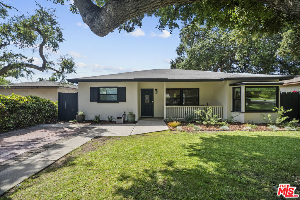 Welcome to this timeless Mid-Century ranch, a true sanctuary where vintage charm meets modern luxury. Nestled on a picturesque, tree-lined street in the heart of North Monrovia, this home offers a quiet, private retreat. Imagine starting your day on the front porch, coffee in hand, as you gaze upon the stunning mountain vistas and the majestic oak tree that graces the front yard.Step inside and feel the home's open, airy embrace. The bright living room, with its generous windows framing the beautiful trees, flows effortlessly into a step-down dining area. This inviting space, complete with a built-in bar, glass-front cabinets, and a wine refrigerator, is perfectly poised for memorable gatherings. The brand-new, eat-in kitchen is a culinary dream, where sleek quartz countertops and crisp shaker cabinets provide a perfect backdrop for the gleam of all-new stainless steel appliances.The large family room, anchored by a romantic brick fireplace, is a warm, welcoming retreat the ideal place to unwind. The home offers three generously sized bedrooms, one of which includes a custom built-in shelving unit. A versatile fourth room offers flexibility as an office, playroom, or an additional bedroom. Both bathrooms have been meticulously updated with new tile, vanities, and high-end designer fixtures that radiate a spa-like tranquility. The magic continues outdoors on this rare, over 10,000 square foot lot. The expansive backyard is an entertainer's paradise, with multiple patio spaces, a freshly poured concrete area/patio for al fresco dining, and a beautiful new pergola. There are also two 10x12 custom sheds that can be used for additional storage or as utility rooms. The lot's unique street-to-street access and convenient alleyway entry provide endless opportunities for development. This property is a visionary's blank canvas. The potential for expansion and new construction is immense, making this an exceptional opportunity for investors or savvy buyers alike. Add a sparkling swimming pool, build a chic Accessory Dwelling Unit (ADU) for rental income or multi-generational living, or take advantage of the generous space to build a second home. With ample room for RV access, this lot is an open invitation to build and develop for years to come. Recent updates and other features include new interior and exterior paint, new tank-less water heater, new Milgard windows in the front of the house, a finished attic space with drop down ladder, central HVAC ensure comfort and peace of mind. The entire home also boasts new flooring throughout, along with updated copper plumbing and electrical. This home is ideally located with close proximity to Old Town Monrovia's charming shops, major freeways, and breathtaking hiking trails. It truly offers a perfect blend of quiet residential life and easy access to every modern convenience, along with exceptional potential for future development. Monrovia living at its finest with endless potential. This home truly has it all.