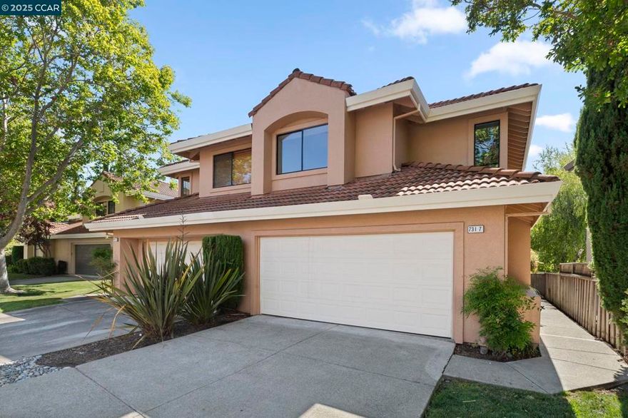 This remodeled unit feels just like a single-family home, featuring an end unit with a large private backyard. It boasts all-new interior paint and flooring. The main level includes a spacious, updated kitchen, a modernized half bath, a generous living room with floor-to-ceiling windows, a cozy fireplace, and a dining area. Upstairs, you'll find the primary suite with a beautifully updated bathroom, two additional bedrooms, and a refreshed secondary bathroom. The updated laundry room is conveniently located on the second floor. Just a short walk to the community pool and spa. HOA DUES INCLUDE WATER, HAZARD INSURANCE, EXTERIOR MAINTENANCE INCLUDING ROOF AND EXTERIOR PAINT. ALL COMMUNITY POOLS, SPAS, PICKLE BALL, TENNIS COURTS AND 24 HOURS A DAY MANNED SECURITY GATE.