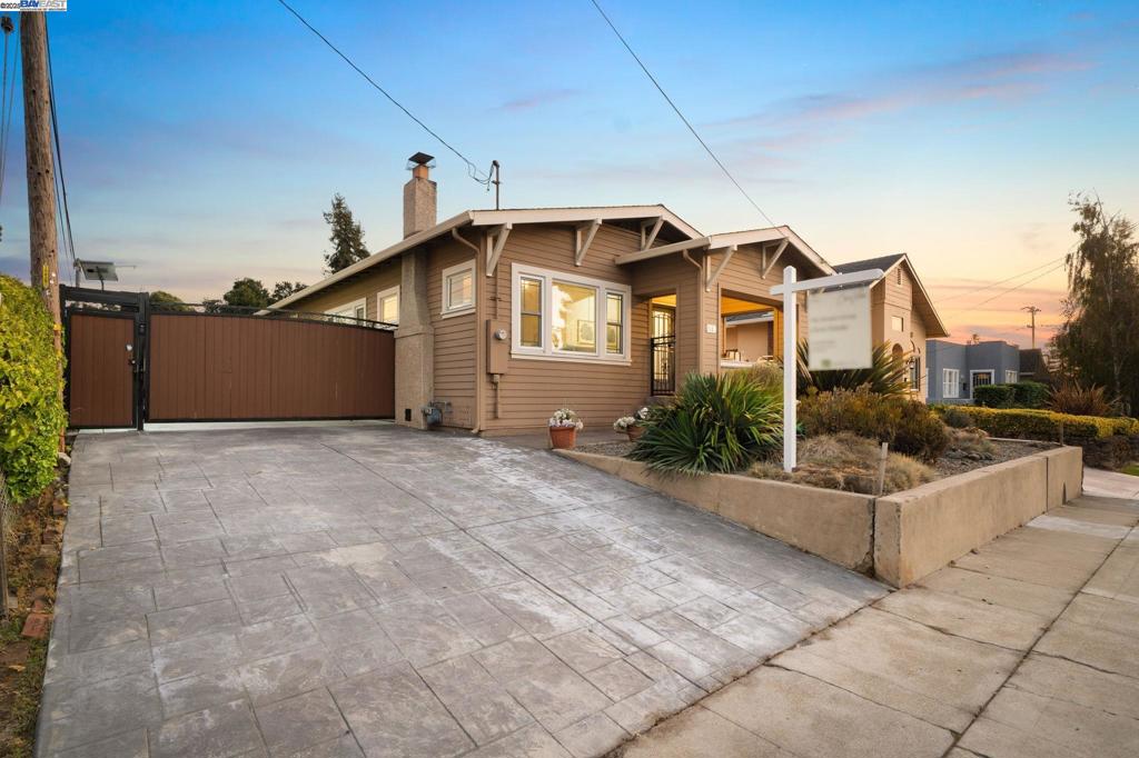 Located in the heart of historic Hayward, this beautifully updated Craftsman home blends timeless character with modern comfort. Situated on an expansive 8,000 sq. ft. lot, it features a drought-resistant front yard, inviting covered porch, and an oversized 2.5-car garage. Inside, natural light fills the spacious living room with tray ceilings, a brick fireplace, and arched doorways. Hardwood floors lead through the dining area to a bright, updated kitchen complete with new appliances, white cabinetry, and a breakfast bar. The home offers three bedrooms with walk-in closets, two updated bathrooms, and a convenient laundry room. The large backyard is perfect for entertaining, relaxing under the covered patio, or creating your dream outdoor space. Ideally located near downtown Hayward’s shops, restaurants, and BART, this home offers the perfect balance of charm, functionality, and convenience.