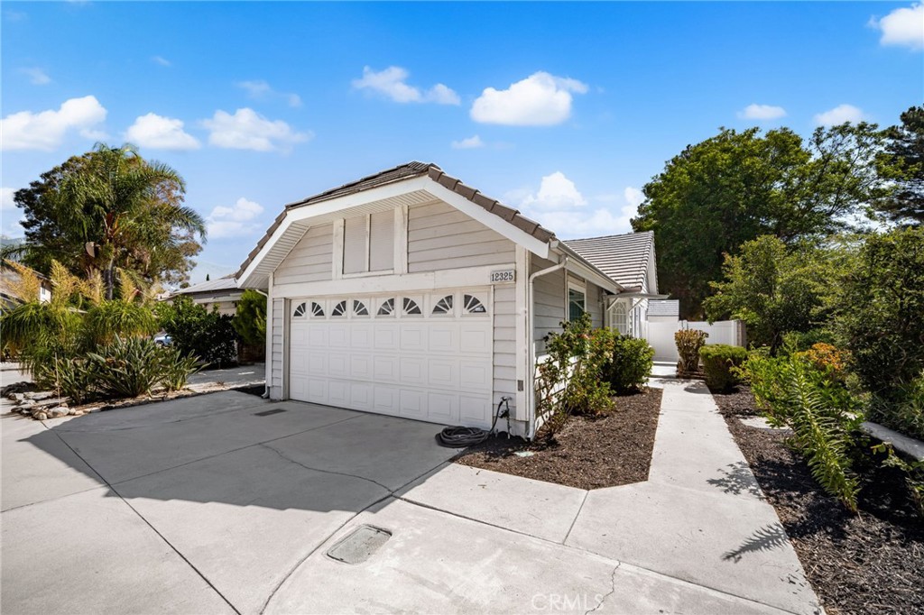 WONDERFUL, Affordable Home in Victoria Park and Walking Distance to Windrows Elementary!! Single Story Attached Housing Located on a FAMILY FRIENDLY CULDESAC!! HIGHLY DESIRABLE LOCATION!! This Home has a GREAT Floor-Plan Offering with 2 LARGE Bedrooms and an Enclosed Patio Room (Kids Playroom or Bonus Room) * * REMODELED Kitchen with GRANITE SLAB Counter-Tops, STAINLESS STEEL Appliances, Breakfast Counter For the Kids, Custom Painted Cabinetry & Breakfast Nook * * Living Room with HIGH PITCHED Ceilings & Media Niche * * Spacious Enclosed Patio Room with Ceiling Fan & Laminate Floors...The PERFECT Play Room, Bonus Room or Indoor Space for the Dogs * * Primary Bedroom with High Pitched Ceilings, BUILT-IN Media Center & Dresser, Direct Access into Your Backyard - AND - Remodeled Bathroom with NEW Vanity with Quartz Counter and Custom Tiled Walk-In Shower * * Enjoy the LOW Maintenance Backyard with a Raised Wood Deck, Covered Patio with Ceiling Fan, Garden Area and Surrounded with Block Walls & Vinyl Fencing * * Upgraded Throughout with Custom 2- Toned Paint, Granite Counters, Designer Fixtures, Raised Panel Doors, Stainless Steel Appliances, Remodeled Bathroom & MUCH MORE * * TWO Car Attached Garage * * WONDERFUL Location is Walking Distance to Windrose Elementary, Windrose Park and Close to Shopping, Dining/Restaurants, Victoria Gardens, Parks, Schools and EZ Freeway Access * * Highly Sought After Community Near Biking & Walking Trails with PICTURESQUE Tree-Lined Streets and Stunning Mountain Views Throughout the Neighborhood!!