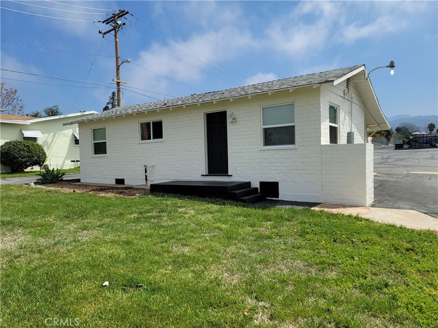 Single-Story 2-Bedroom House with a Bonus Room in Yucaipa! Vinyl Plank Flooring throughout, Stove/Oven (electric), and Central AC/Heat. No Washer/Dryer Hookups and No Fenced Yard. Spacious Detached Garage for Storage Only. Driveway Parking. Water, Trash, Sewer, and Gardening Provided! Will consider 1 Cat Only.