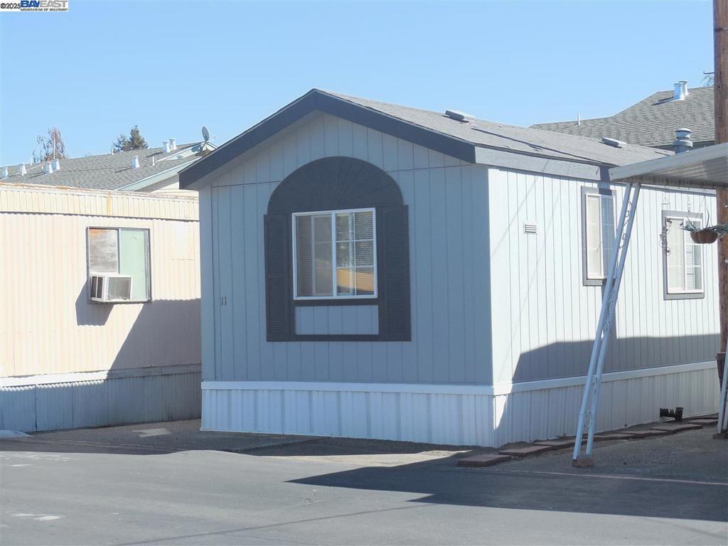 Manufactured Home - Situated in a private, all-age park with a monthly space rent of $800. Recently refreshed with new paint, this charming home features central heat, vaulted ceilings, and dual-pane windows for year-round comfort. Enjoy the convenience of an in-home laundry area equipped with an updated washer and dryer. Offering 2 bedrooms, 1 full bath, and 672 sq. ft. of thoughtfully designed living space, plus guest parking for visitors. Ideally situated near BART, shopping, and public transportation, with quick access to Highways 580 and 880. Park approval required. Fireplaces: NO