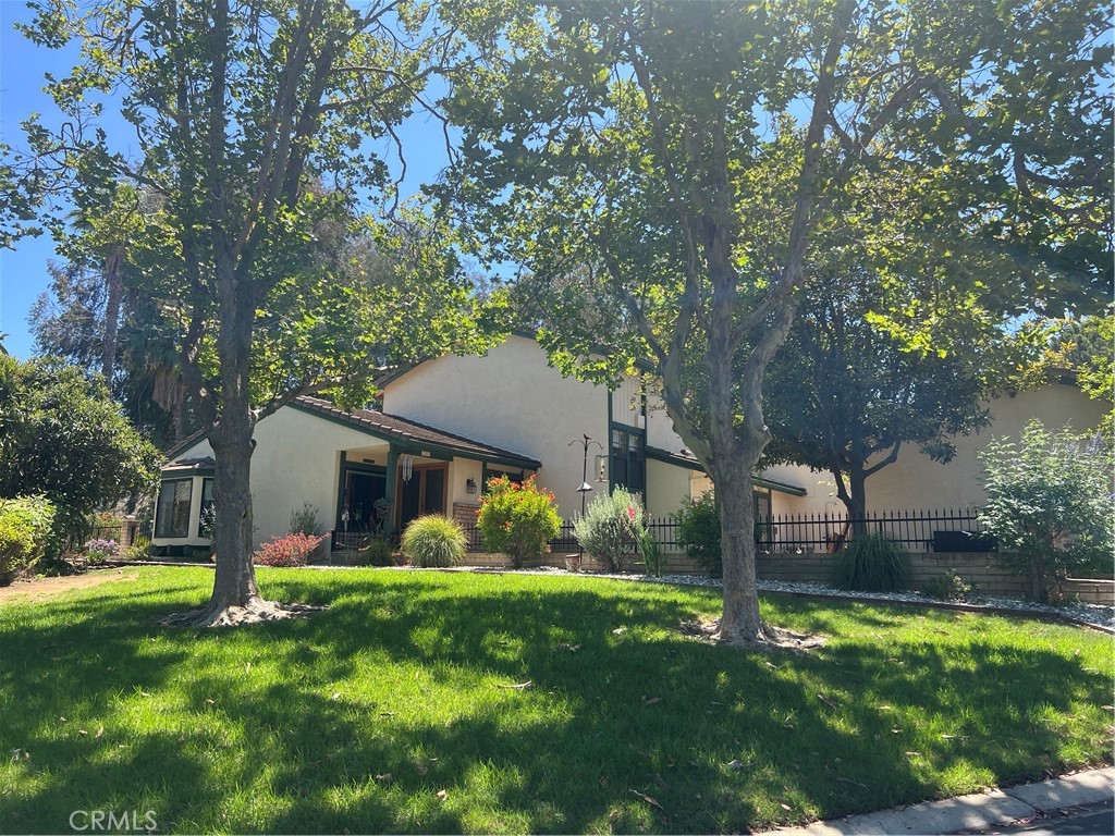 Tucked away in a peaceful cul-de-sac, this hidden gem offers the perfect blend of privacy, beauty, and convenience. this home enjoys an abundance of natural light and serene views from several areas of the home. A beautifully landscaped front yard leads to a charming, gated courtyard---tranquil welcome into the home.
A welcoming entry, and a spacious living room that features vaulted ceilings, wood-framed windows, plantation shutters, and a stunning brick fireplace with a custom wood-and-brick mantel. Laminate wood flooring adds charm and continuity.
The French country-style kitchen is a gourmet's dream with upgraded appliances, a center island, granite countertops, decorative stone backsplash, tile floors and picturesque backyard views. It flows into an oversized dining area with built-in French country cabinetry, most all with custom pull out drawers including the pantry, and a wall-length buffet in dining area---ideal for hosting gatherings.
Downstairs includes 2 bedrooms, one is a versatile bedroom currently used as an office with sliding doors to the front courtyard, a full bath, and a separate laundry room.
Upstairs, the expansive primary suite features relaxing serene views, a spacious bath, an expanded vanity with double sinks and 2 closets.
A secondary bedroom includes a large closet, plantation shutters, and a beautiful view. Adjacent to this bedroom is another full bath
This home also boasts a rare three-car garage with built in cabinets, work bench and a built-in sink. Conveniently located near schools, parks, shopping and just minutes to the 91-freeway access-----yet feels worlds away in its peaceful, park-like surroundings. Truly a rare opportunity to own a special retreat that feels like home the moment you arrive. This truly is a home you do not want to miss!