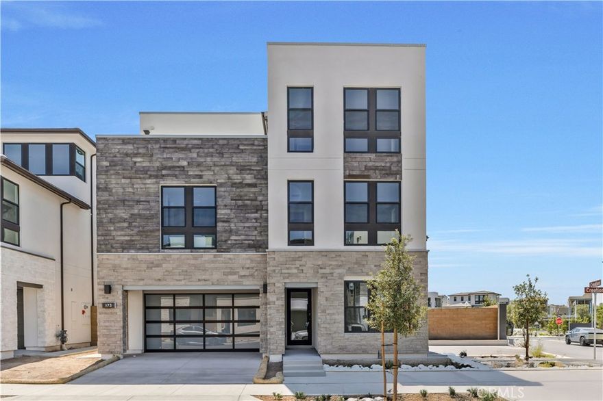 Brand-new luxury home with solar panels, 6 bedrooms, 5 bathrooms, and a loft with a covered deck—nestled in Irvine’s sought-after Great Park community. Enjoy soaring ceilings, abundant natural light, and a chef’s kitchen with high-end appliances and walk-in pantry. The first-floor suite is perfect for guests or multigenerational living, while the expansive primary offers a spa-inspired bath and huge walk-in closet. Each bedroom has its own bath, and the third-floor loft opens to a private deck for relaxing or entertaining. Energy-efficient features, including solar, help cut electricity costs without sacrificing comfort. Walking distance from top-rated Cadence Park School (K 8) and Portola High School, and minutes from resort-style parks and pools, and Irvine’s best shopping and dining.