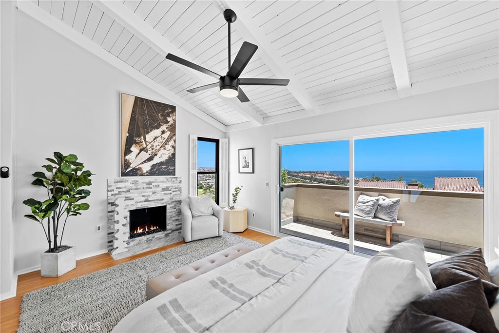 SHORT TERM LEASE available starting August 2025. Get ready to immerse yourself in the coastal lifestyle in this magnificent 3-bedroom, 2.5-bathroom Spanish-style villa in the gated community of Monarch Bay Villas. Marvel at the awe-inspiring white-water views of Salt Creek Beach and expansive ocean panoramas encompassing Catalina and San Clemente Islands. Gaze upon the world-class luxury resorts of the Ritz Carlton and the Waldorf Astoria, while overlooking the renowned Monarch Beach Golf Links, all from the comfort of your own abode. This 2,045-square-foot residence offers ocean views from its open-concept living room with high wood-beamed ceilings, a fireplace, and a generous private oceanview deck, perfect for relaxation and entertainment. The well-appointed kitchen boasts granite countertops, a large peninsula with a wine chiller, herringbone Saltillo tile flooring, and modern appliances, including a dishwasher, gas cooktop, and oven. The primary suite is a haven of comfort and luxury, featuring an ensuite bath, dual vanities, a fireplace, a spacious walk-in closet, and a delightful private balcony to soak in the breathtaking views. Residents enjoy a host of community amenities such as a pool, spa, sauna, clubhouse, billiard room, barbeques, and fitness room, creating a resort-like lifestyle. Just a stone's throw away, Monarch Bay Plaza offers an array of amenities, including restaurants, cafes, salons, fitness centers, and upscale shopping, providing convenience and luxury at your doorstep. Don't miss the chance to make this coastal paradise your next home. Schedule a showing today and prepare to be captivated by the unparalleled luxury and beauty that Monarch Bay Villas has to offer. This is a SHORT TERM LEASE available beginning August 2025.