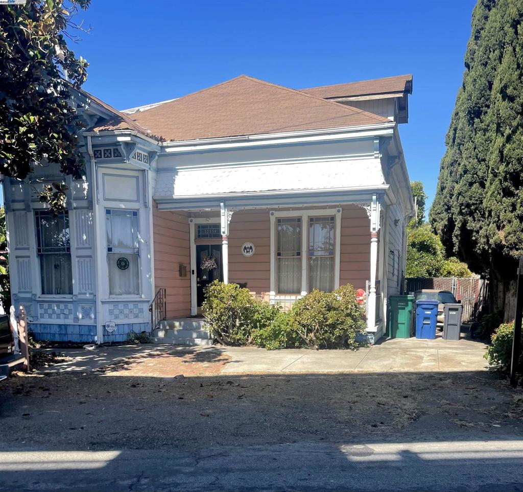 If you are ready to put some sweat equity or completely bring your contractor in, this enchanting Victorian Gem is waiting for you! Located 2 Minutes away from Downtown Hayward. With its quintessential white picket fence, the home offers a unique investment opportunity for those with a vision. Discover a beautiful Victorian jewel with elegant ceiling medallions and unique light fixtures, high ceilings offering character, original hardwood floors, intricate wood and window trims and wainscoting details. The layout includes four bedrooms and two baths evenly distributed across 2 stories. The Parlor's double pocket doors open to an elegant dining area, ideal for gatherings. A spacious kitchen offers backyard access, complemented by a separate laundry room. Enjoy the beautiful backyard full of mature fruit trees ready for you to make it a charming spot for relaxation. While the home faces BART tracks and requires some serious clean up, this location offers easy access to downtown and it's restaurants and entertainment. This commuter-friendly location blends historic elegance with modern potential, making it a perfect choice for visionaries.