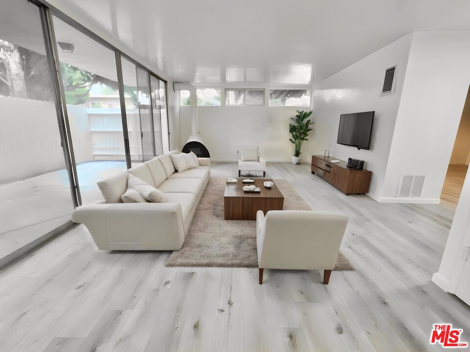 Welcome to this stunning modern 2-bedroom, 1-bathroom unit in the heart of Santa Monica. Fully renovated, this modern home features a brand new kitchen; fully equipped with stainless steel appliances. The large sliding patio doors grace the living room with natural light, creating a bright and airy ambiance. The renovated bathroom offers a double vanity, light-up mirror, and a luxurious shower. Both bedrooms come with ample closet space. Outside, you'll find a huge private patio perfect for relaxing or entertaining. Situated in a prime location, enjoy easy access to shops, dining, and nearby freeways, making this the ideal Santa Monica living experience.