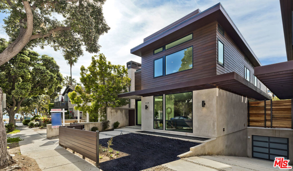 Steps from Prime Santa Monica Beach. Stunning modern home, available now. On-site parking for 3+ cars. State-of-the-art masterpiece. A total of 5 BR open floor plan allows an easy flow from Great Room to formal dining to magnificent entertainer's kitchen that includes top tier Wolf and Subzero appliances and over-sized island. The kitchen opens to the sophisticated and drought-resistant landscaped backyard with high end BBQ Counter. Sliding pocket doors open completely to an outdoor side deck dining area, ideal for parties al fresco. The ground floors also has an en-suite bedroom and powder room. Downstairs features a guest room, laundry room, gym/media room, kitchenette, an enormous storage room for bikes and surfboards. Second floors with 3 en suite bedrooms + laundry rm. Luxe master has treetop views, walk-in closet and 5-star bath. Huge rooftop deck with fire pit and ocean view hot tub. A must see!