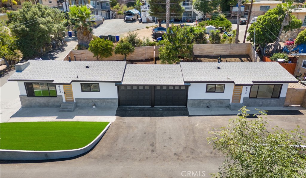 Beautifully Remodeled Duplex in the Heart of Vista, CA... Welcome to this stunning, fully remodeled duplex located in the vibrant heart of Vista! Each spacious unit features 2 bedrooms and 2 modern bathrooms, thoughtfully updated with stylish finishes and attention to detail throughout. Step into open-concept living spaces that offer cozy fireplaces and gorgeous kitchens equipped with elegant waterfall countertops, deep farmhouse sinks, and updated cabinetry—perfect for everyday living and entertaining. Both units include their own 1-car attached garage, ensuring privacy and convenience for residents. Enjoy low-maintenance outdoor living with synthetic turf in both the front and backyards, creating the ideal space for relaxing, entertaining, or letting pets and kids play freely. Each fenced backyard provides privacy and functionality, making it great for gatherings and family time. Recent improvements include brand-new asphalt paving, giving the property a fresh, clean look with plenty of additional parking available around the property.
Situated within walking distance to local grocery stores, shopping, coffee shops, and dining, this duplex offers the perfect blend of modern comfort and central convenience. Whether you're looking for a multi-generational living option, a prime investment opportunity, or a place to call home—this property is a must-see!