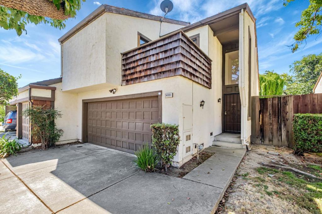 Welcome to this inviting 3B 2.5B home located in the vibrant city of Fremont. With a generous 1,555 sq ft of bright living space, this corner-unit townhome with low HOA fee combines contemporary upgrades with timeless comfort. Step inside to discover a light-filled open floor plan with soaring vaulted ceilings and gleaming laminate flooring. The modern kitchen boasts stainless steel appliances and ample cabinetry. The living area flows seamlessly to a private balcony. Upstairs, the primary suite features soaring vaulted ceilings and generous closet space, while two additional bedrooms offer flexibility for guests, a home office, or a growing family. Additional highlights include recessed lighting, an in-unit laundry room and a 2-car attached garage with a long driveway for extra parking. The deeper-than-average backyard is a rare find, providing space for outdoor entertaining or gardening. Located minutes from the Dumbarton Bridge (I-84) and I-880, this home offers easy access to Silicon Valley and the Bay Area. Families will appreciate the proximity to top-rated schools, including Patterson Elementary(7/10), Thornton Junior High(8/10), and American High(10/10). With a vibrant community and nearby amenities, this townhouse is a perfect blend of modern living and prime location.
