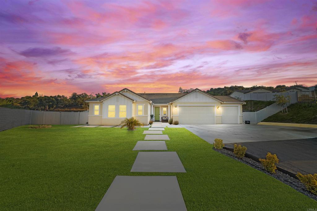 Welcome to 27983 Evergreen Way, a stunning 2023 built single story home perfectly situated on a corner lot in a desirable new Valley Center community. Offering 4 spacious bedrooms, 2.5 baths, and a 3 car garage, this home combines modern luxury with low-maintenance living. Inside, you’ll find an open concept layout featuring quartz countertops with a full backsplash, soft closing cabinetry, upgraded kitchen appliances, and a large walk in pantry ideal for any home chef. The luxury vinyl plank flooring throughout pairs beautifully with the master suite, complete with a generous walk in closet. Added upgrades include a whole house water filtration system and energy efficient living powered by 18 paid solar panels and 2 Tesla Powerwalls. Step outside to a professionally landscaped backyard with artificial turf in front and back, a retaining wall with built in drainage and irrigation, and a covered aluminum patio with a ceiling fan perfect for relaxing or entertaining. This vibrant community offers resort style amenities, including a clubhouse, sparkling pool, playground, and walking/hiking trails, all while being surrounded by scenic open space. Nearby, enjoy Daley Ranch and Hellhole Canyon trails, combining rural tranquility with outdoor adventure. Plus, your home is protected with a 5 year appliance warranty and 10 year structural warranty for peace of mind. If you’ve been looking for a turnkey home with energy savings, modern finishes, and access to nature, this Valley Center gem has it all.