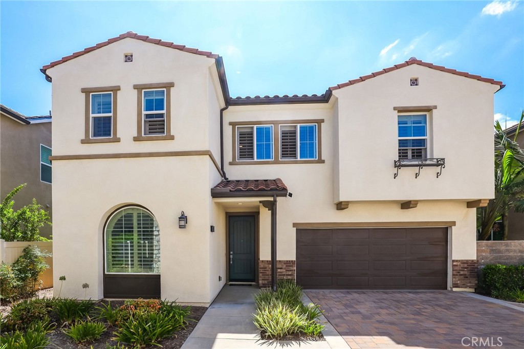 Located in the Gated Resort Style Community of Ironridge, this Stunning 4 Bedroom Turn-Key Residence is Fully Upgraded and Impeccably Designed for the Modern Buyer. Offering Designer Finishes, this Elegant home has everything your family has been looking for. Gorgeous Neutral Toned Wood Look Vinyl Flooring Runs Throughout The Entire Home. Soaring Two-Story Ceilings and a Light & Bright Interior bathed in Natural Light greet you upon entrance and introduce this home in style. Continue into the Open Concept Great Room featuring Cathedral Ceilings, Expansive Windows w/ Plantation Shutters, Dining Area and Beautiful Glass Door Slider Creating Quintessential California Indoor/Outdoor Living. The Chef’s Kitchen has it all featuring Beautiful Upgraded White Cabinets, Stainless Steel Appliances, Gas Stove, Water Filtration, Artisanal Tile Backsplash, Quartz Countertops, and Large Center Island w/ Bar Seating. The highly desirable Downstairs Bedroom w/ Full Bathroom provides incredible flexibility and convenience for any family. Upstairs you will find the Spacious Laundry Room, 3 Additional Bedrooms and the Charming Multi-Purpose Loft. Unwind & Relax in the Tranquil Spacious Primary Suite Retreat featuring an Abundance of Natural Light leaving you well rested and calm. Ease Yourself into a New Wellness Routine in your Spa-Like Primary Bathroom featuring Dual Vanities, Quartz Countertops, Restorative Glass Walk-In Shower w/ Custom Designer Tile Accents, Neutral Tile Flooring and Spacious Walk-In Closet. The Tranquil Backyard has low maintenance Landscaping and Custom Tile Flooring and enjoys supreme privacy with no direct rear neighbor. This Residence also features a Spacious 2 Car Garage w/ Epoxy Flooring and a Private End Unit Location. Ideally located just a short walk to Resort Style Amenities including Hiking Trails, Swimming Pool & Clubhouse…Beautiful Home...This is the One, come see it in person!