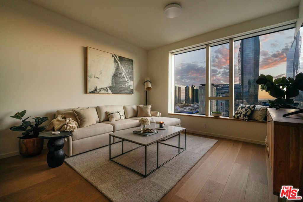 Wake up to golden sunlight spilling across the skyline and the hum of the city below where every moment feels cinematic. This is Metropolis: a private sanctuary rising above the heartbeat of Downtown LA. Inside, a beautifully curated 1-bedroom 1.5 bath retreat invites both calm and connection where open spaces flow seamlessly from a chef-inspired kitchen to a light-filled living room made for late-night talks or quiet mornings with coffee and a view. Step beyond your door and into resort-style living a pool that mirrors the city lights, a serene spa for slow Sundays, a fitness center that inspires movement, and lounges that make every gathering feel elevated. Even your four-legged companion has their own luxe park to play in. Here, life moves with ease and elegance concierge services at your call, security around the clock, and the city's best dining, art, and nightlife just steps away. Metropolis isn't just a home. It's your story unfolding in the sky where luxury meets possibility.