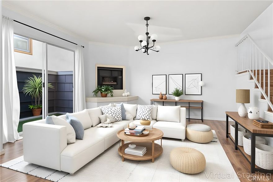 Modern Elegance in Prime Sherman Oaks -  Beautifully renovated townhome located in the heart of Sherman Oaks. Offering 2 bedrooms and 1.5 baths.  A perfectly combines modern design with everyday comfort. Step inside to discover a bright, sun-drenched interior with wood-like floors throughout, a spacious living room with a raised fireplace, and seamless access to a private patio. The sleek kitchen features stainless steel appliances, with an attached dining area creating a sophisticated space for cooking and entertaining. Upstairs, you'll find two generously sized bedrooms and thoughtfully updated bathrooms. Head up to the private rooftop deck that offers the perfect place to relax and unwind. Enjoy peace of mind in this gated community, complete with secure side-by-side garage parking. Just moments from the best of Ventura Blvd, you'll have easy access to top-tier shopping, dining, and entertainment. This is urban living at its finest — stylish, secure, and superbly located