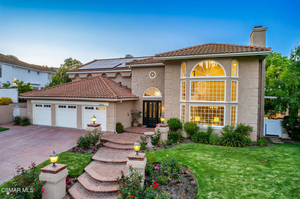 Sensational Mediterranean estate in the highly desired Morrison Highlands section of Agoura Hills! An absolute premier location and setting in one of the Conejo Valley's most requested communities. Ideally set above street level is this grand SIX bedroom villa which has been updated to include newer hardwood floors, updated bathrooms and more. The dramatic two story entry boasts a sweeping curved staircase and leads to nearly 5000 square feet of impressive floorplan ideal for a family lifestyle. There are 4 bedrooms upstairs and 2 down. The primary is enhanced with cathedral ceilings and a see through fireplace opening to a fantastic large sitting room/office. The primary bath is graced with natural stone floors, soaking tub, granite counters and two large walk in closets. The center island kitchen provides Calcutta quartz counters, top of the line appliances and a family size breakfast room with French doors and windows. The family room opens from the kitchen and has been beautifully designed with wood beamed ceilings, wood floors, fireplace and an abundance of french doors and windows providing extraordinary natural light. The resort quality grounds is incredible with custom pebble tech pool and spa along with a cascading waterfall. There is also a tremendous covered patio, barbecue center and massive manicured lawns all with total privacy! Other amenities include a solar system, 3 newer A/C units, security cameras, newer pool equipment and a finished 3 car garage with newer epoxy floors. The location of this beauty is ideal and is close proximity to the award winning schools, shopping centers, parks and more all with easy freeway access.