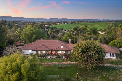 Photo of 1650 Winterwarm Drive, Fallbrook, CA 92028 (MLS # SW26007543)