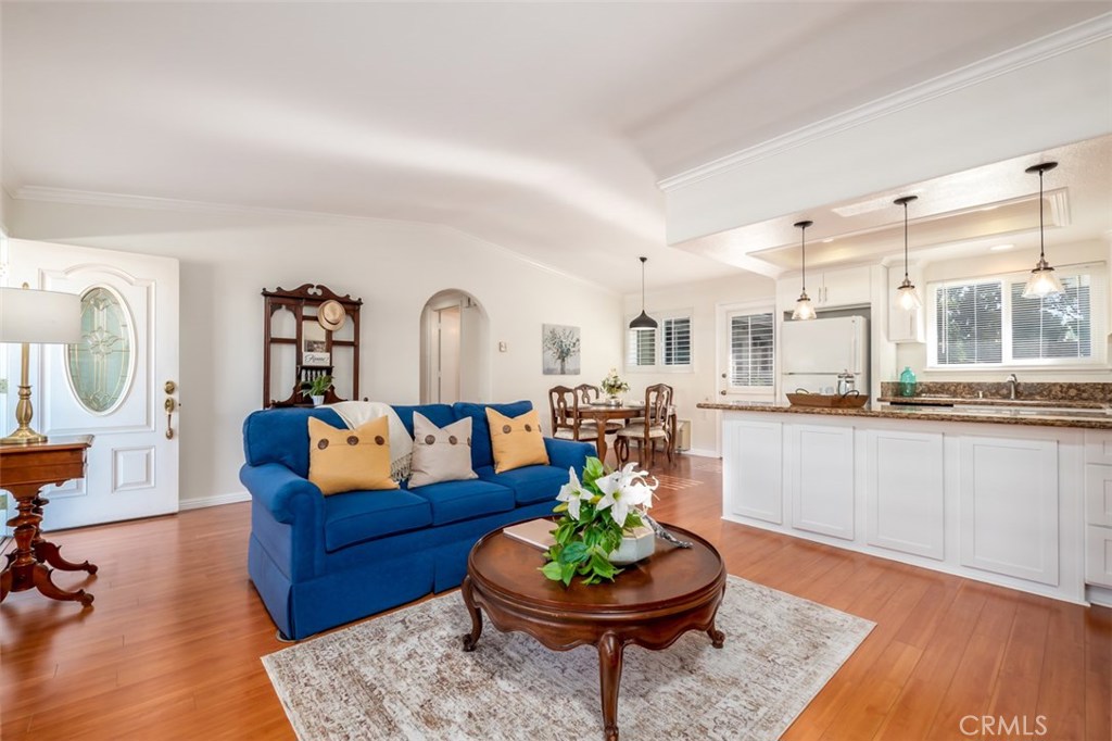 Put this perfect home & best value at the top of your list to visit. Private remodeled one story San Sebastian bungalow with pleasant greenbelt views from each window and lovely tile patio. 2 bathrooms, laundry with stack washer/dryer. (no stairs, nobody above or below) White shaker cabinetry in kitchen & baths. Kitchen w/ breakfast bar open to living & dining, recessed & pendant lights & granite slab counters. 2 baths with white shaker cabinetry, stone counters, solatubes for natural light-1 has walk-in shower, 1 has tub/shower. Washer/Dryer & linen storage in hall. Smooth ceilings, white paint throughout, crown molding in every room, large baseboards, laminate wood floor, plantation shutters, dual pane vinyl frame windows. Primary bedroom will fit a king size bed, plus dressers & has 2 closets. Great location greenbelt in front, tiled patio that can be gated, close to parking, cul-de-sac 9 carport 514-3. Quiet location with easy access to gates, clubhouse 3 & 1, library, creek, serpentine walk & bus. Laguna Woods Village is Southern California's premier coastal age qualified guard gated community. 27 holes of golf, tennis, gyms, 5 pools, spas, 7 clubhouses, bocce ball, billiards, performing arts, dance, 250 clubs and organizations, equestrian center and trail, RV parking, garden center, workshops for wood, ceramics, painting, sewing, lapidary, ceramics. Reasonable HOA fees include water, sewer, trash, building maintenance & insurance as well as cable tv.